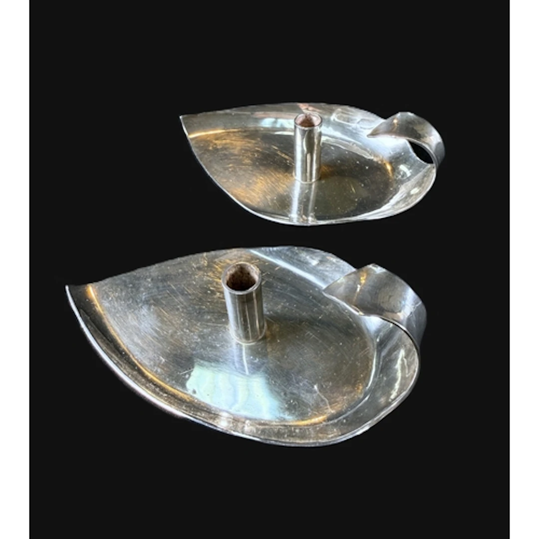 Two hall marked silver modernist candle holders in the form ...