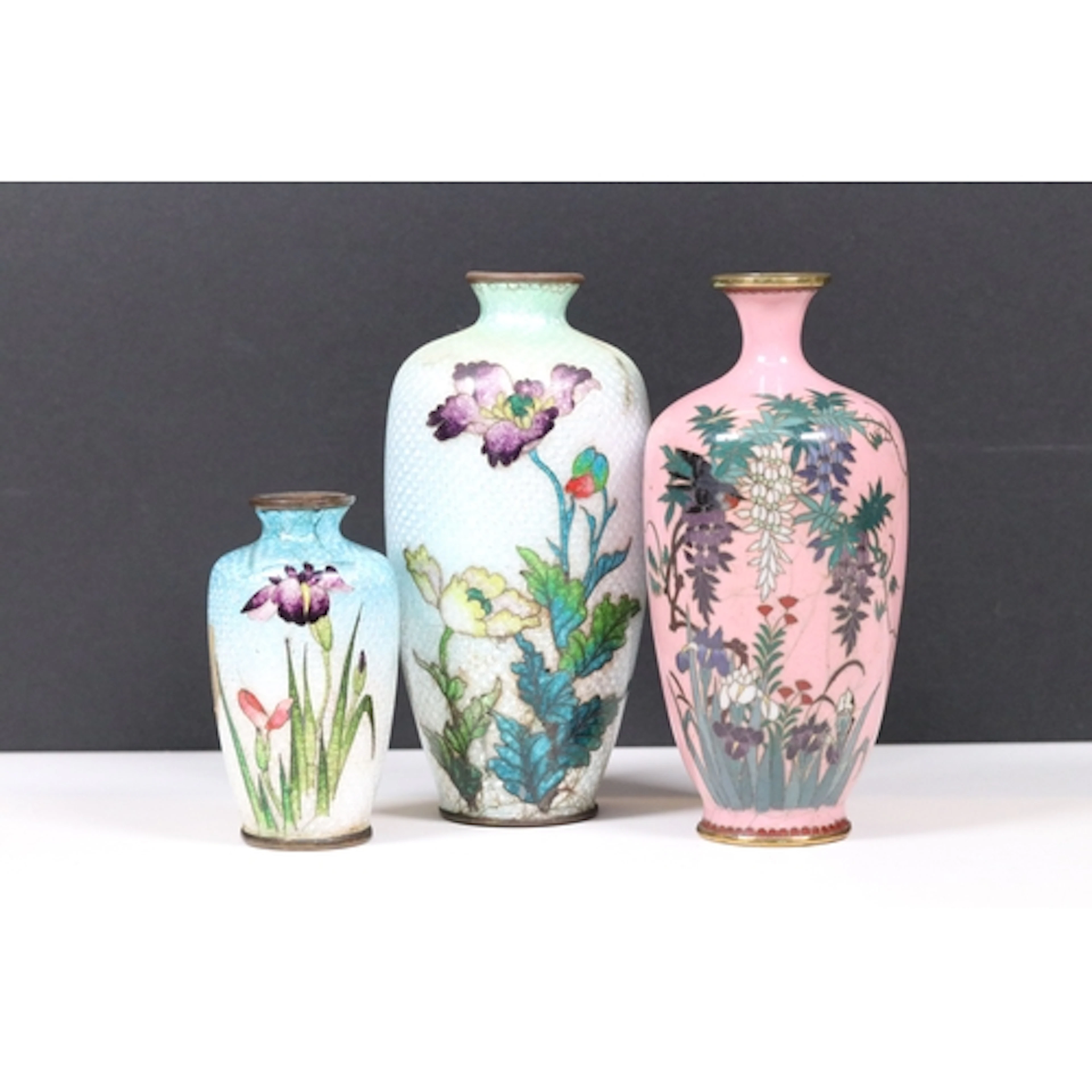 Three Japanese cloisonne vases, to comprise one pink ground ...
