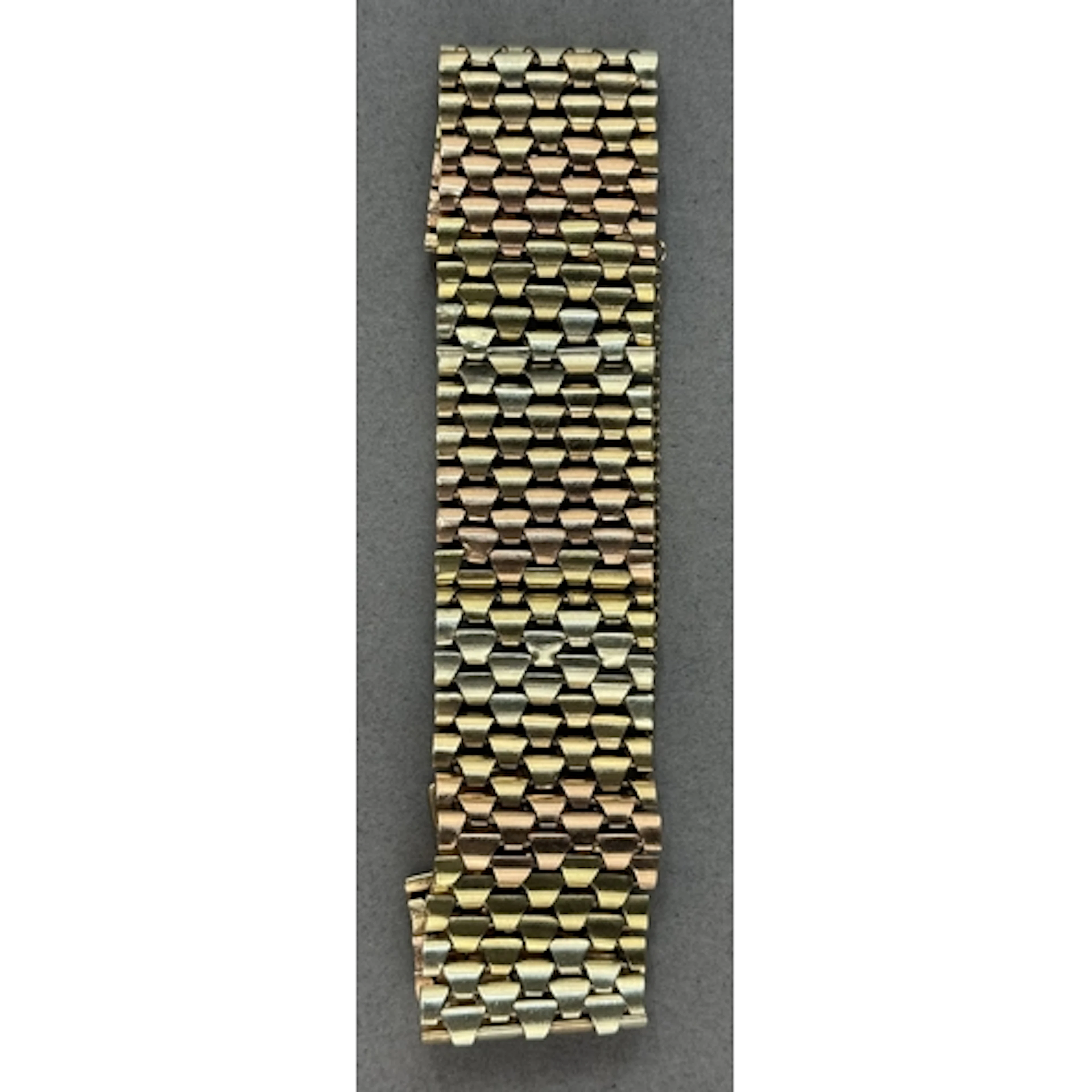 Jewellery: a 9ct three colour gold multi row link bracelet, ...