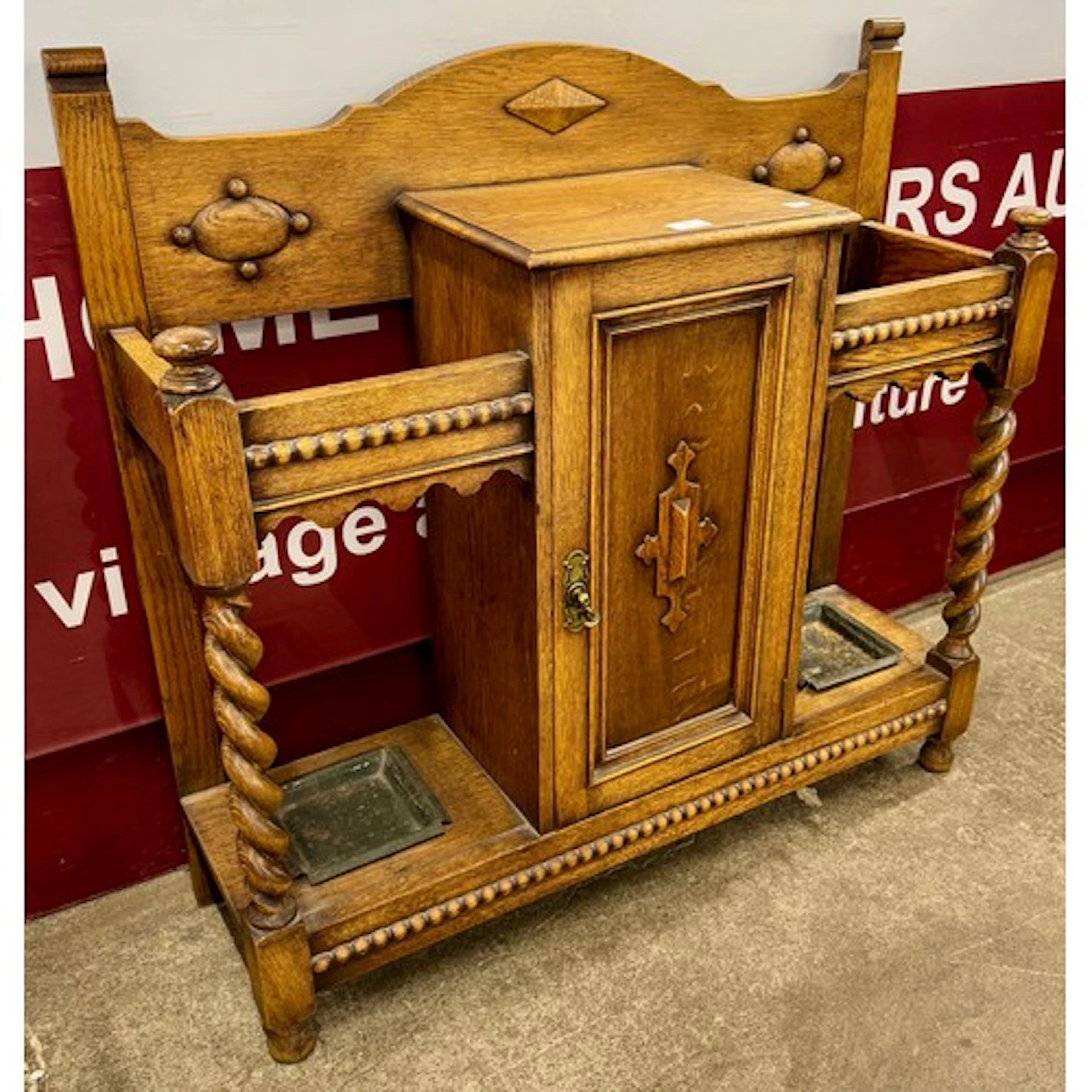 An Arts and Crafts oak hallstand
