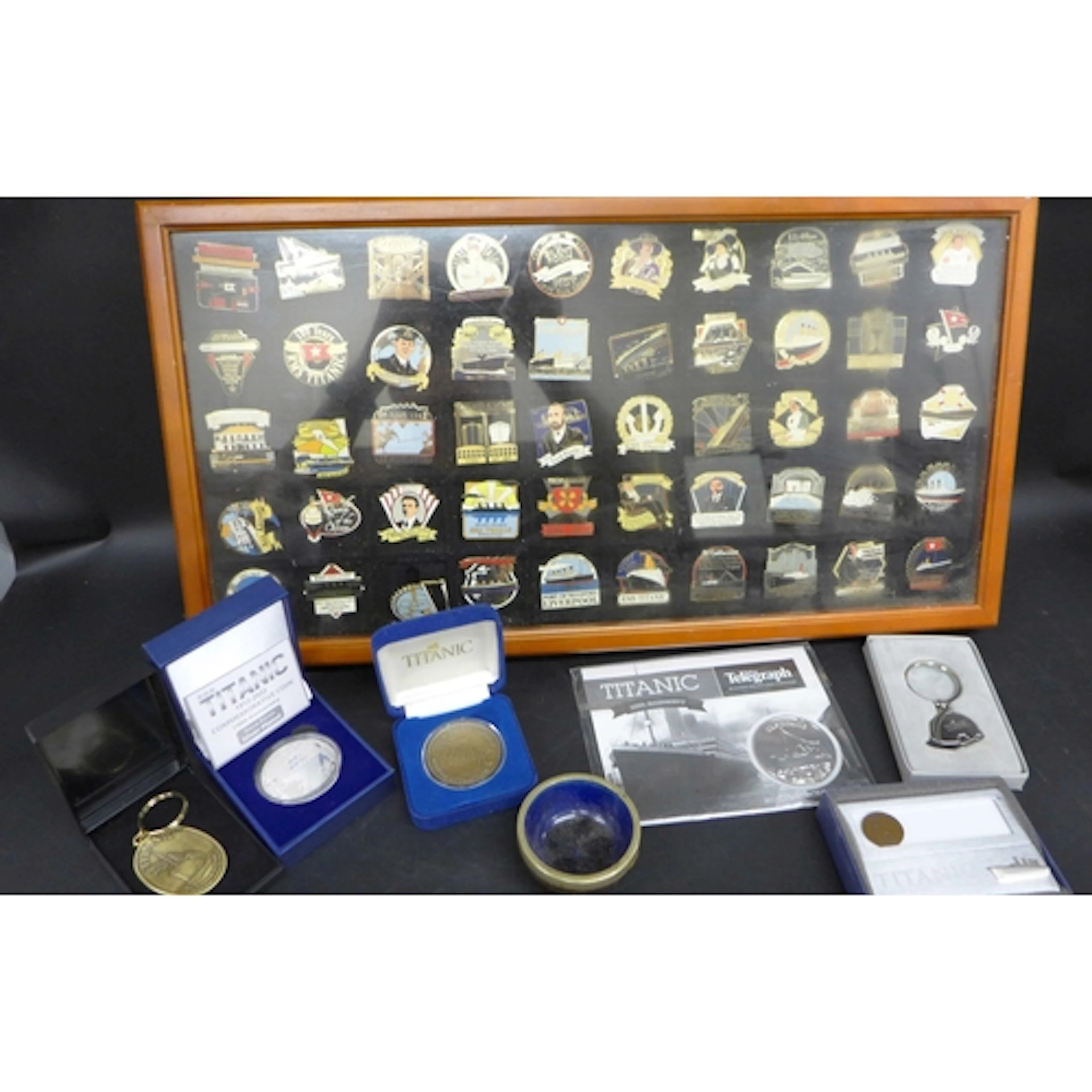 A collection of commemorative Titanic coins and medals, toge...