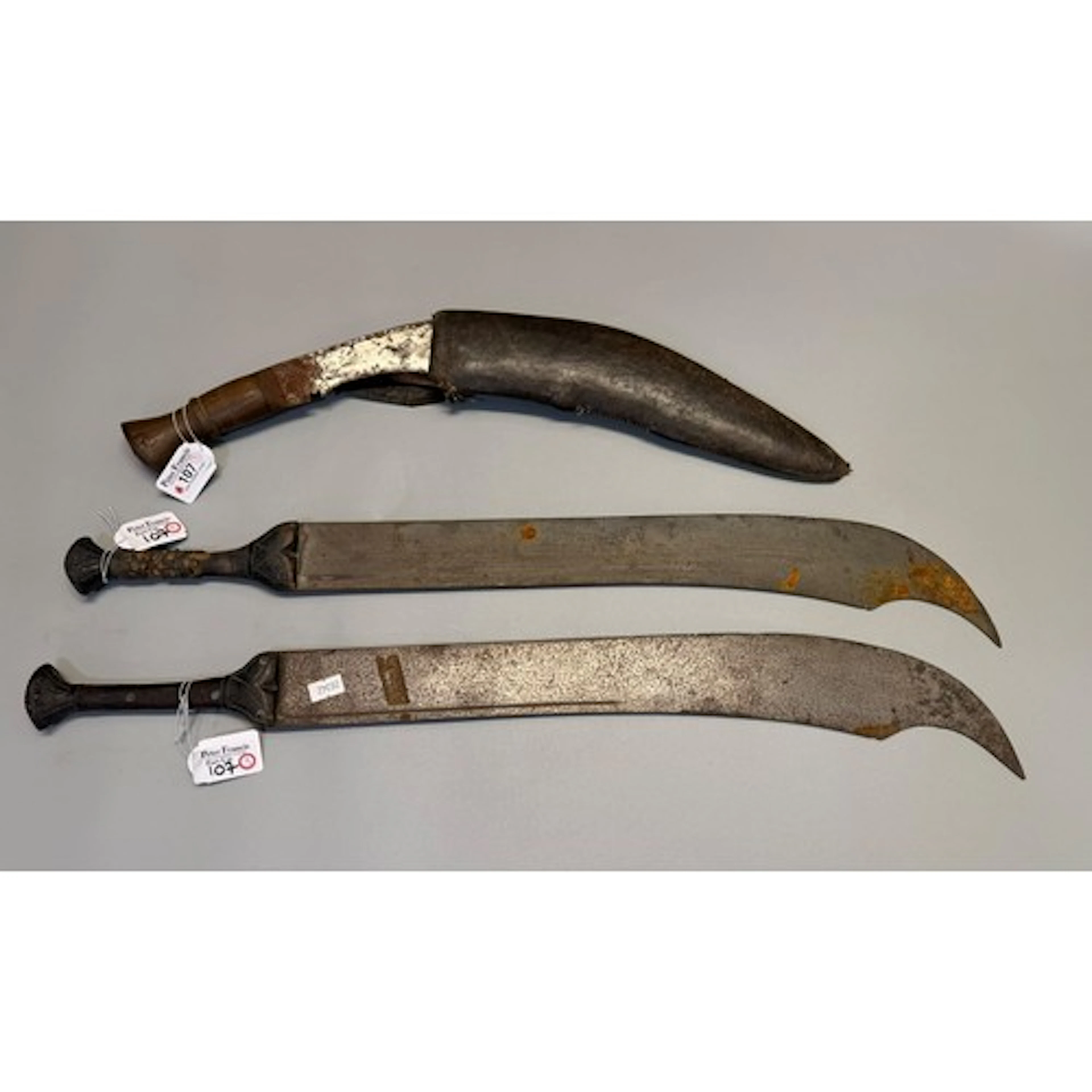 Two Chinese Dadao-style swords with carved wooden grips, bla...