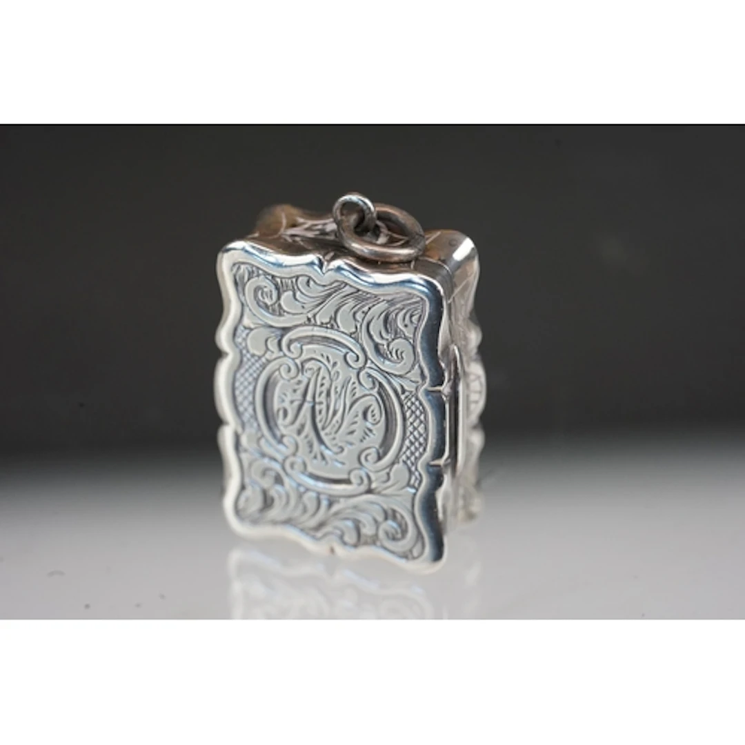 Victorian silver foliate engraved vinaigrette, the central c...