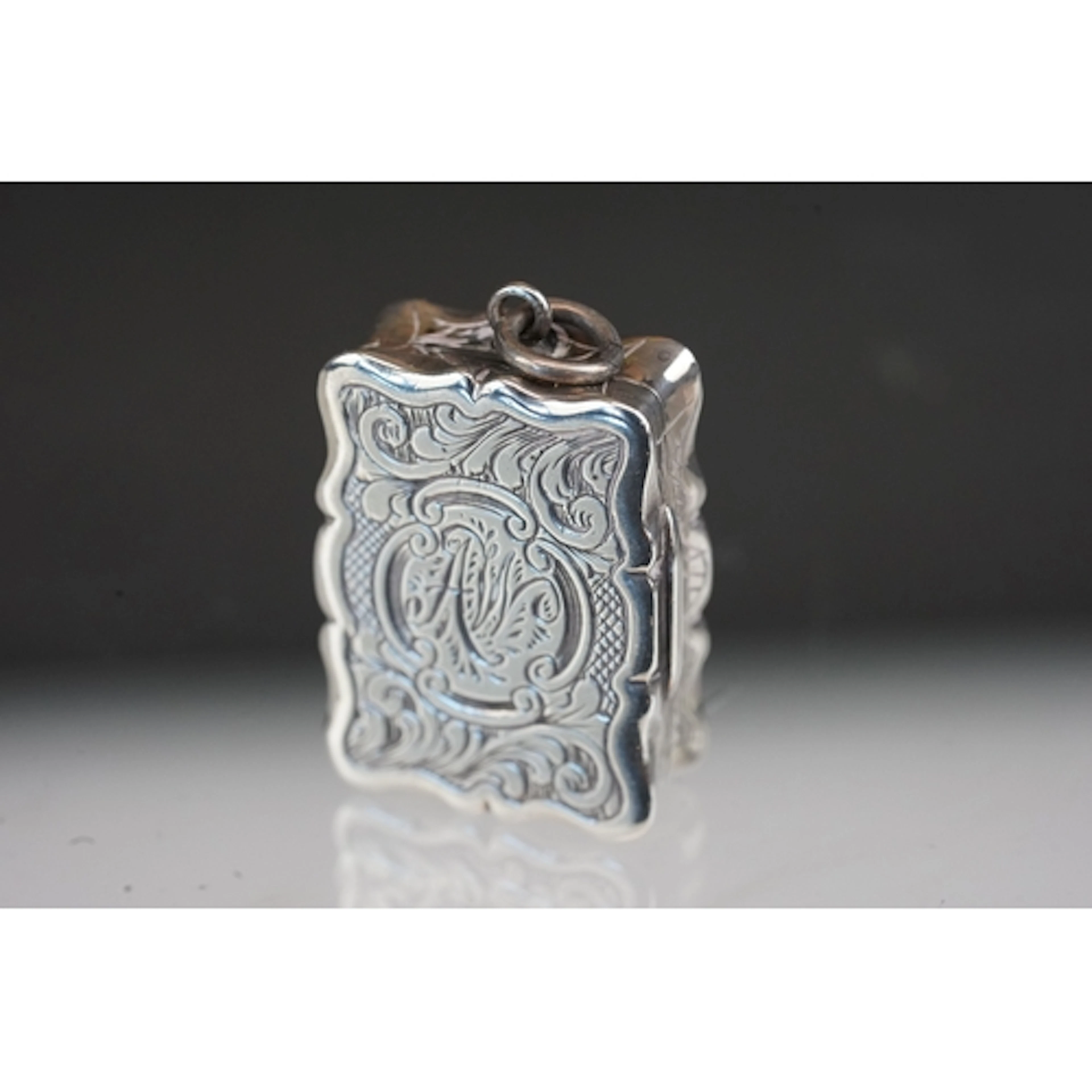 Victorian silver foliate engraved vinaigrette, the central c...