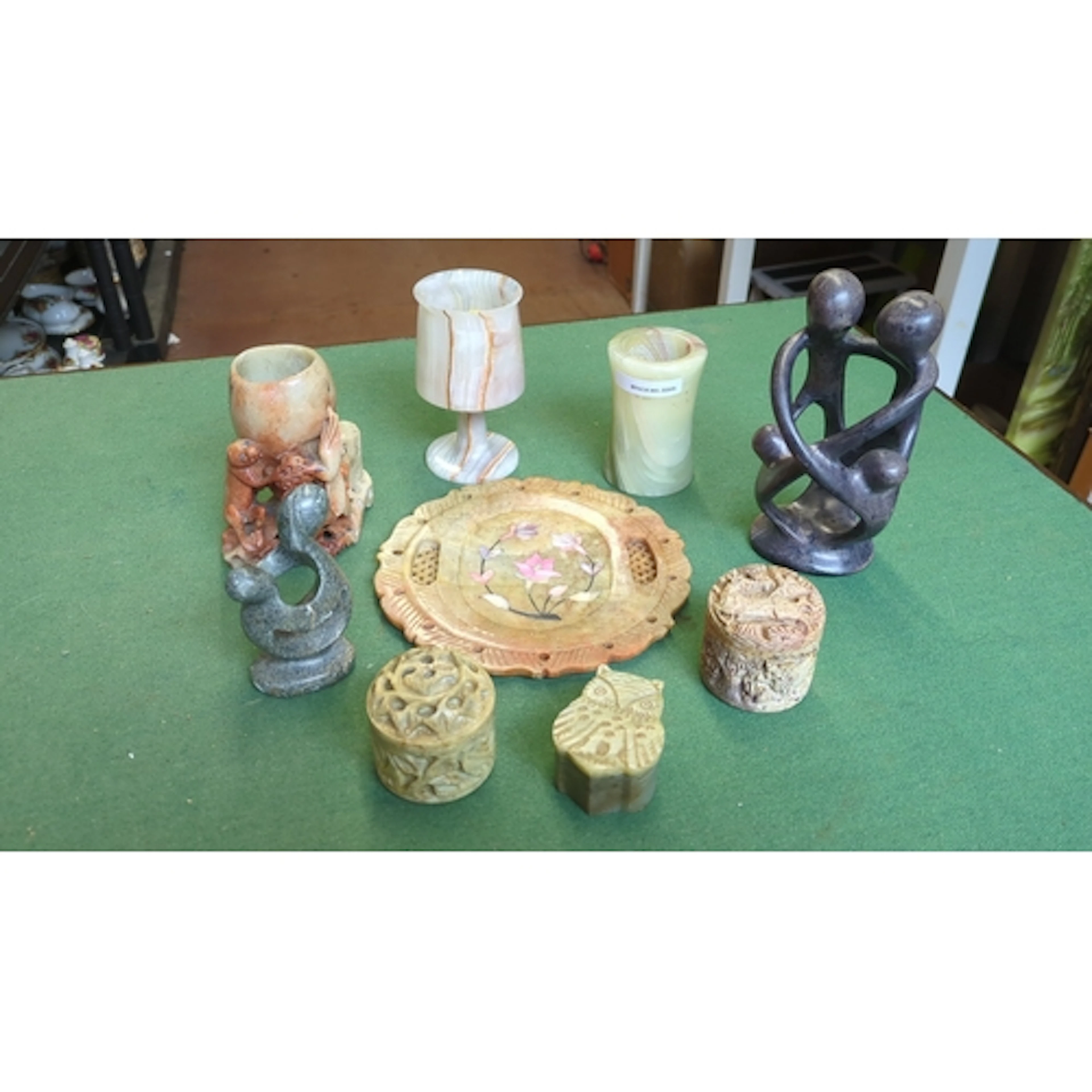 A group of carved hardstone decorative objects, including an...