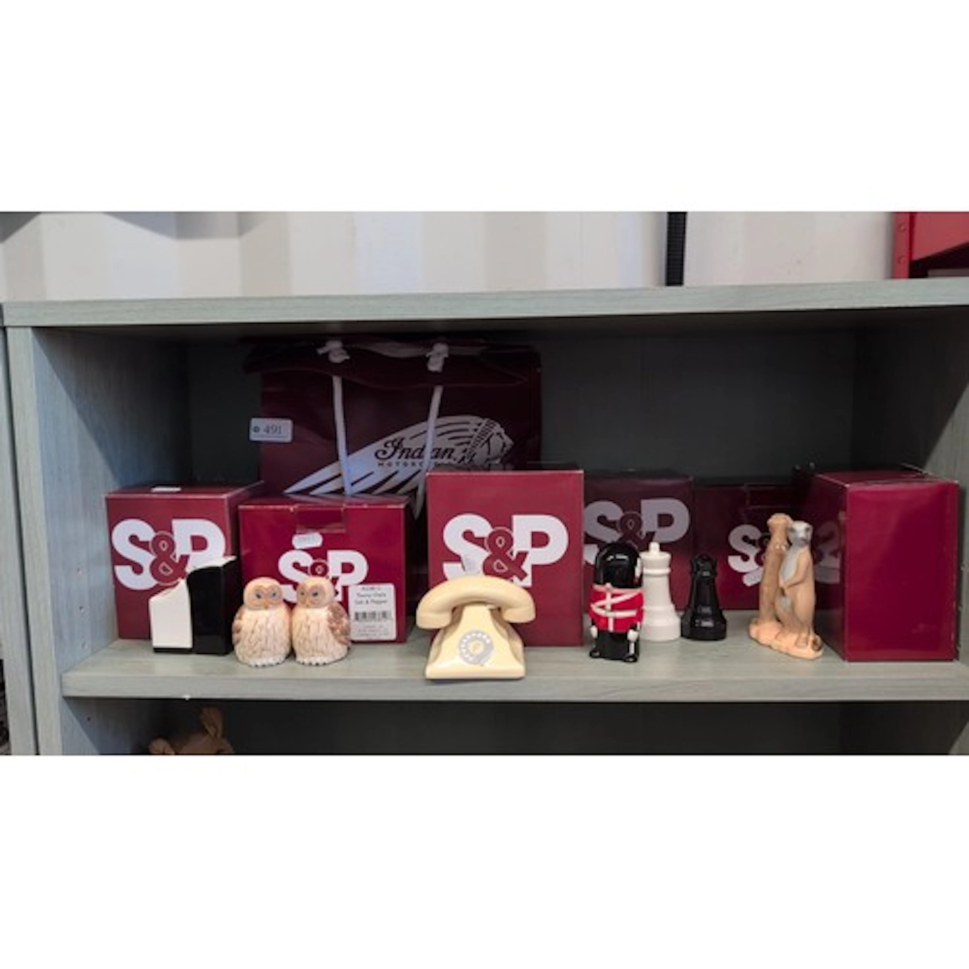 A collection of novelty ceramic salt-and-pepper shakers, inc...