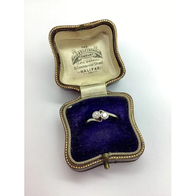 A Vintage Two Stone Diamond Crossover Ring, collet set with ...
