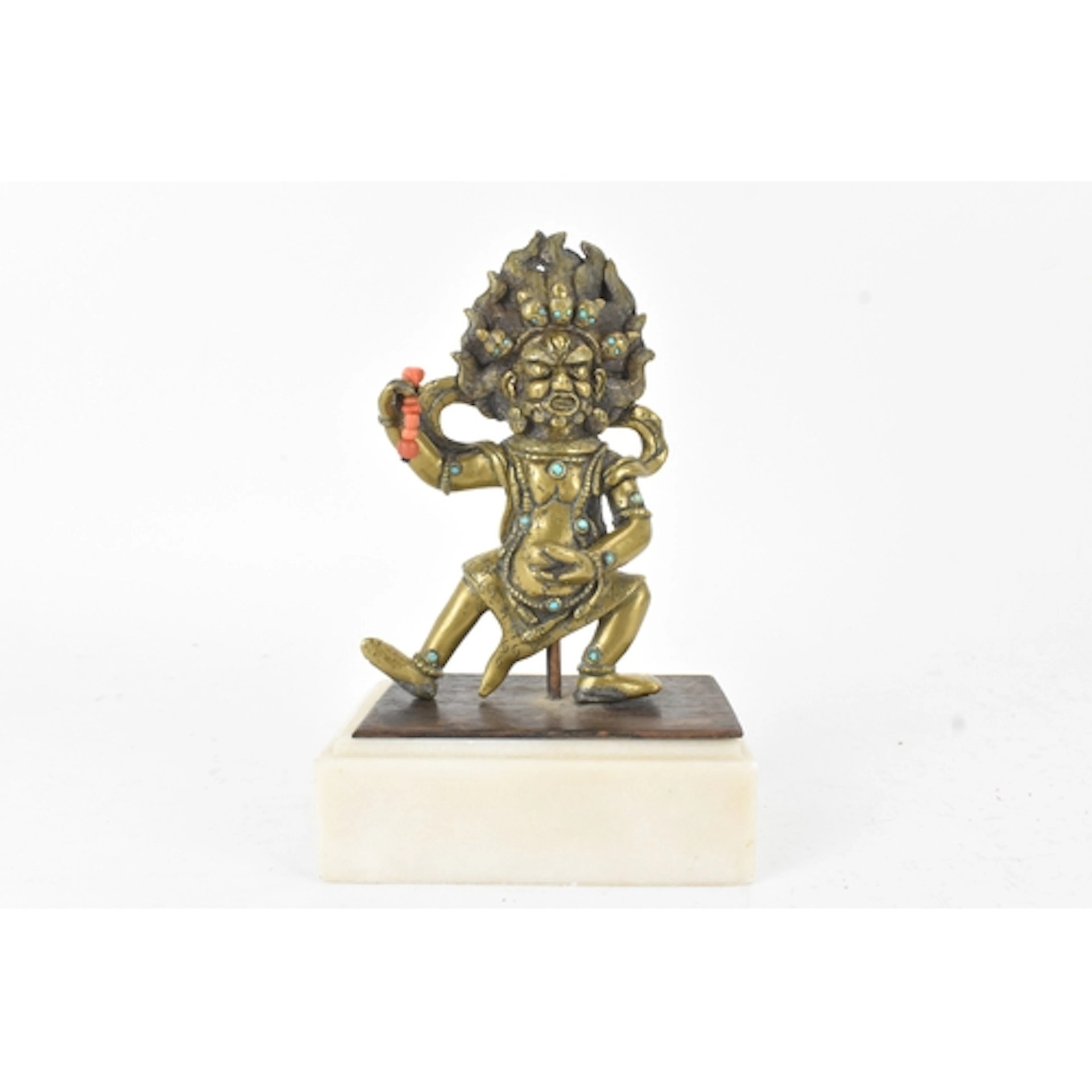 A Tibetan gilt-bronze figure of Mahakala, modelled in a dyna...