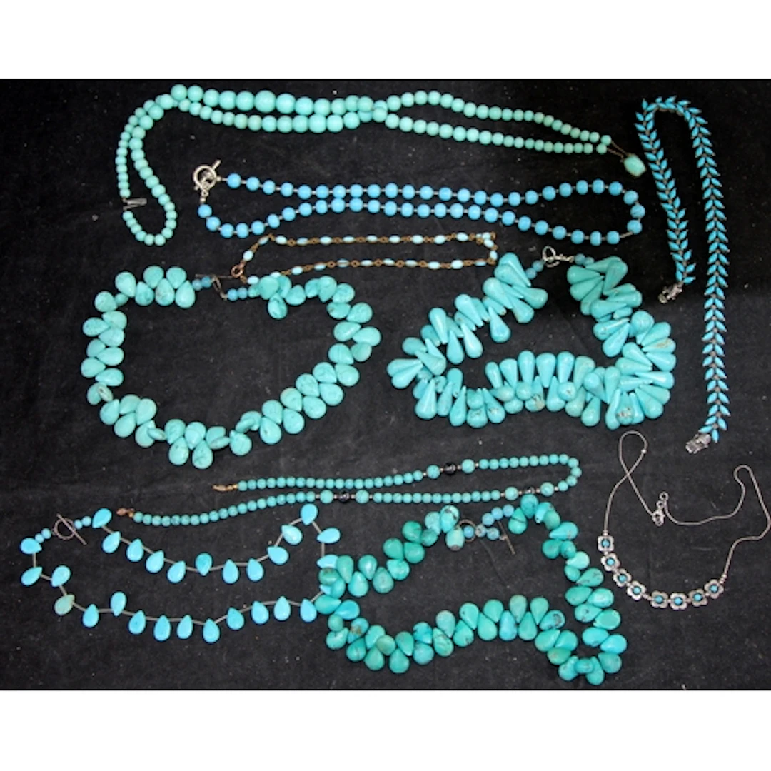 A collection of Turquoise beaded necklaces