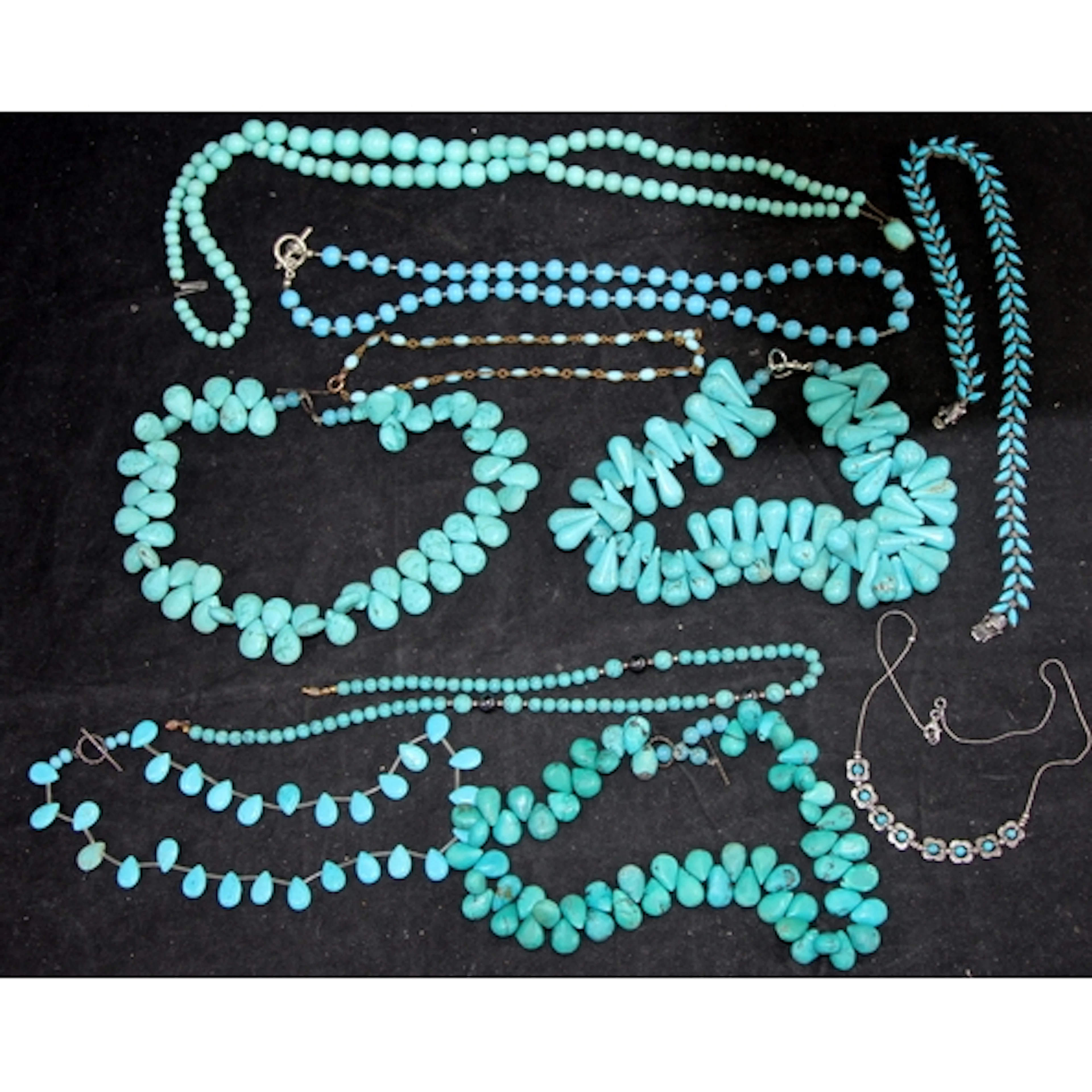 A collection of Turquoise beaded necklaces