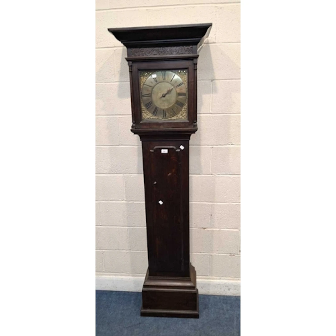 AN OAK CASED 30 HOUR LONGCASE CLOCK, the 12 inch brass dial ...