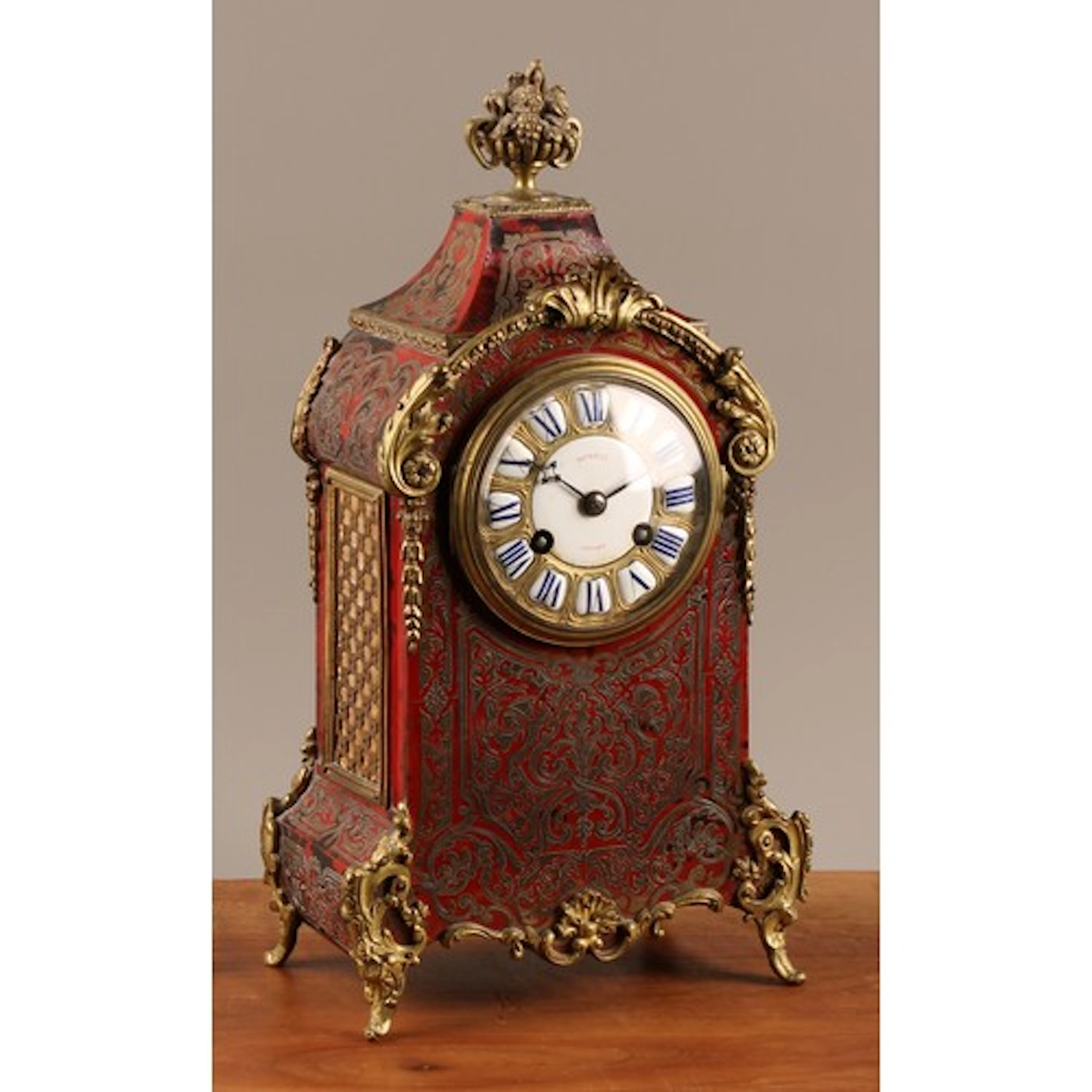 A 19th century French gilt metal mounted Boulle mantel clock...