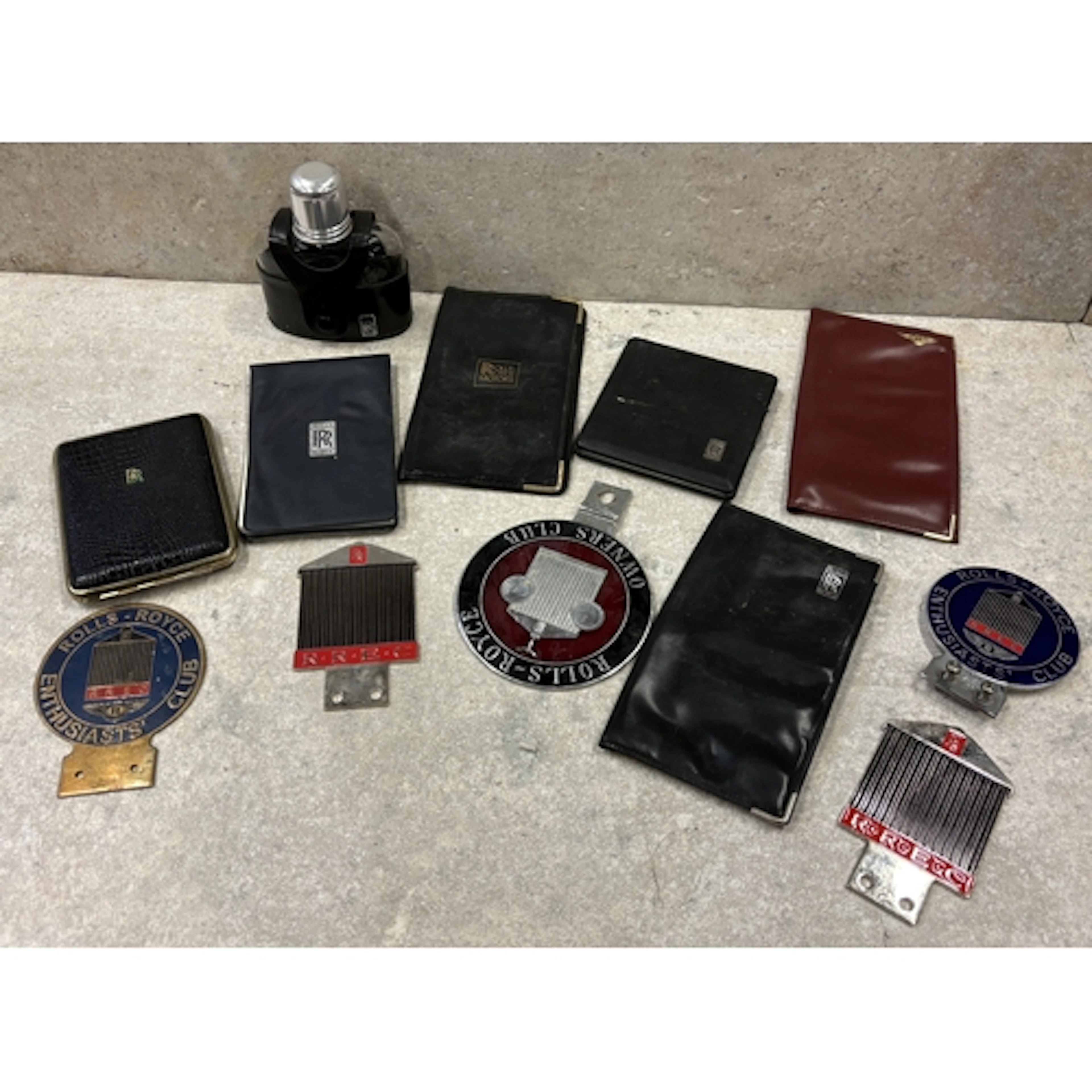 A collection of Rolls Royce Owner's Club badges together wit...