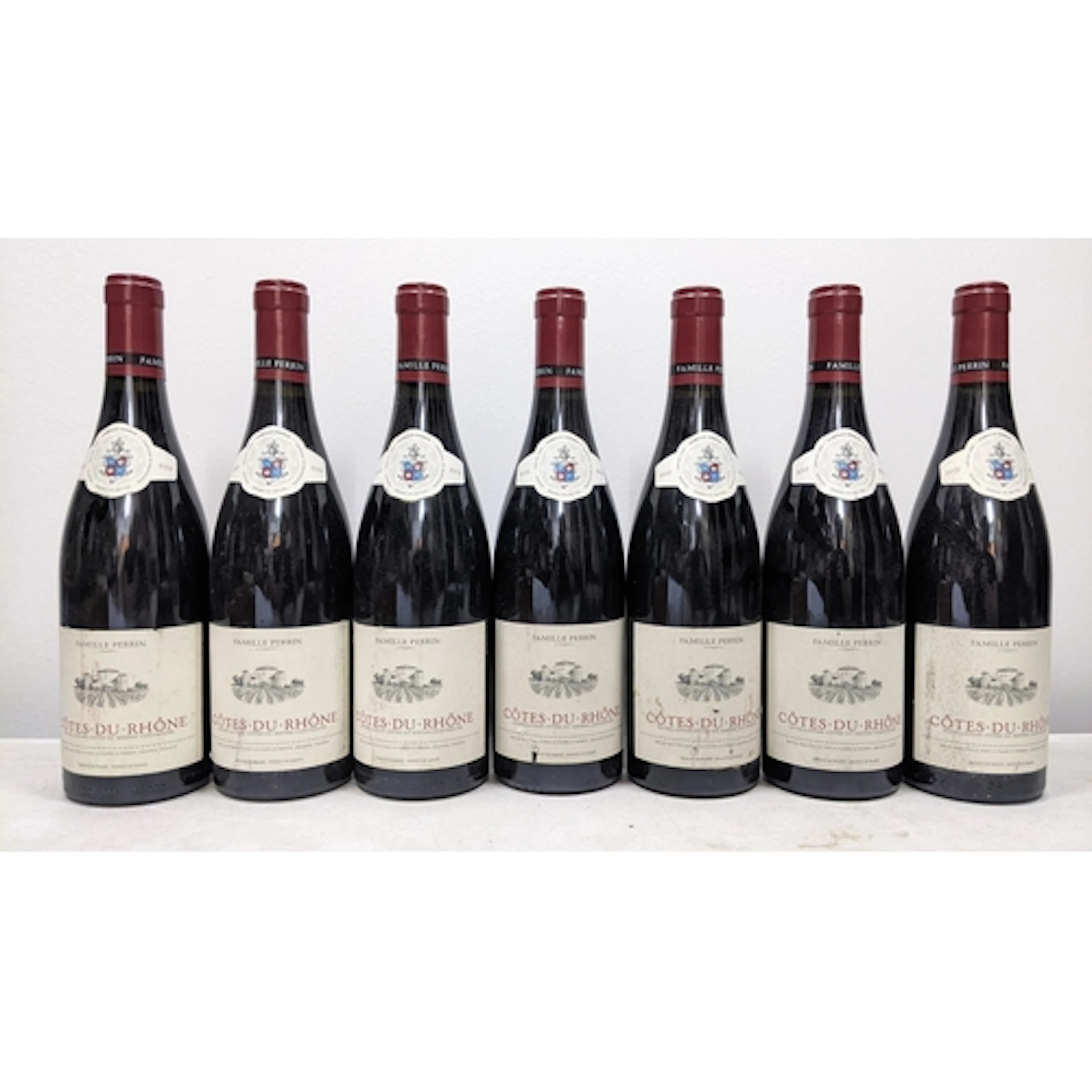Seven bottles of 2012 Famille Perrin Côtes-du-Rhône red wine...