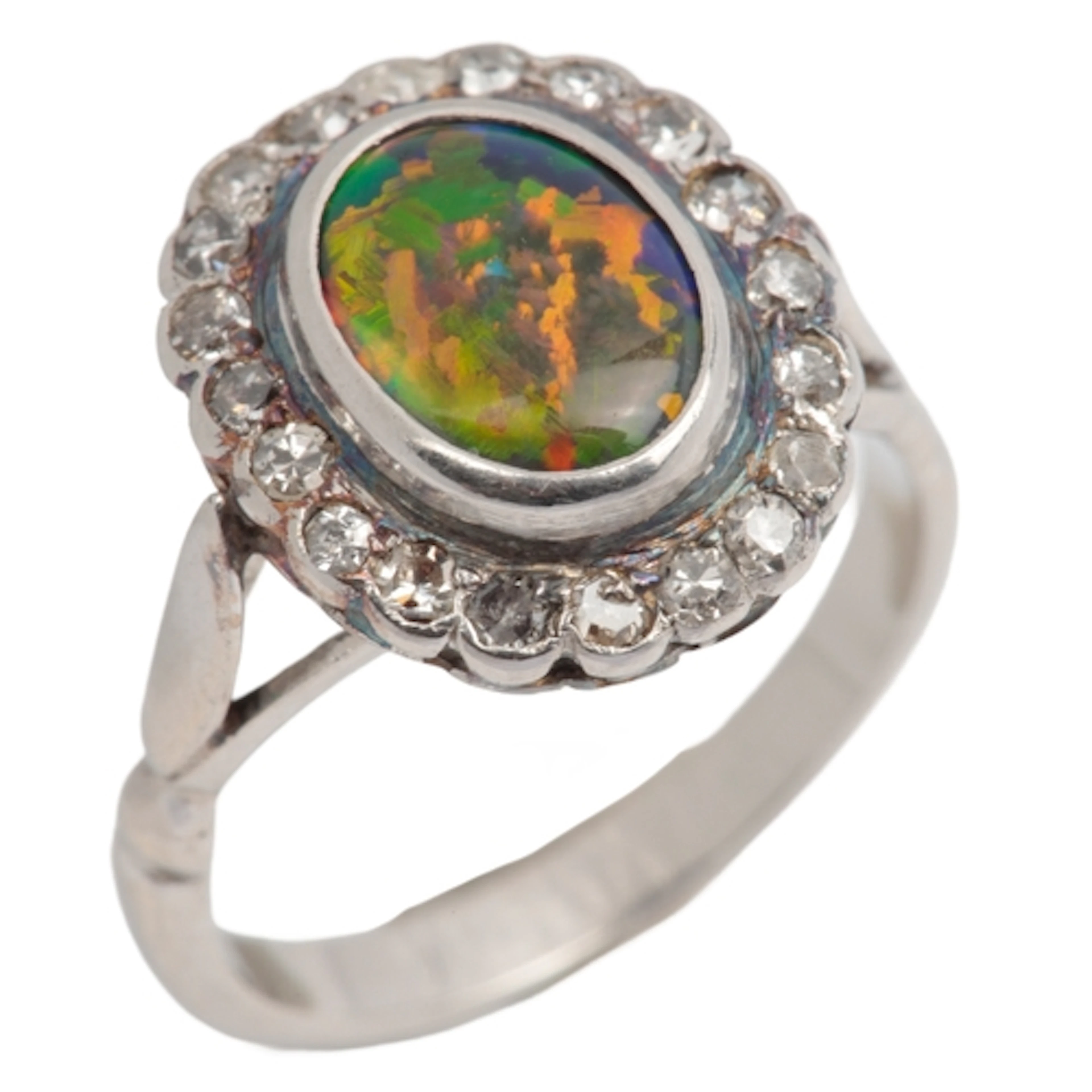 A black opal and diamond cluster ring, mid 20th century, col...