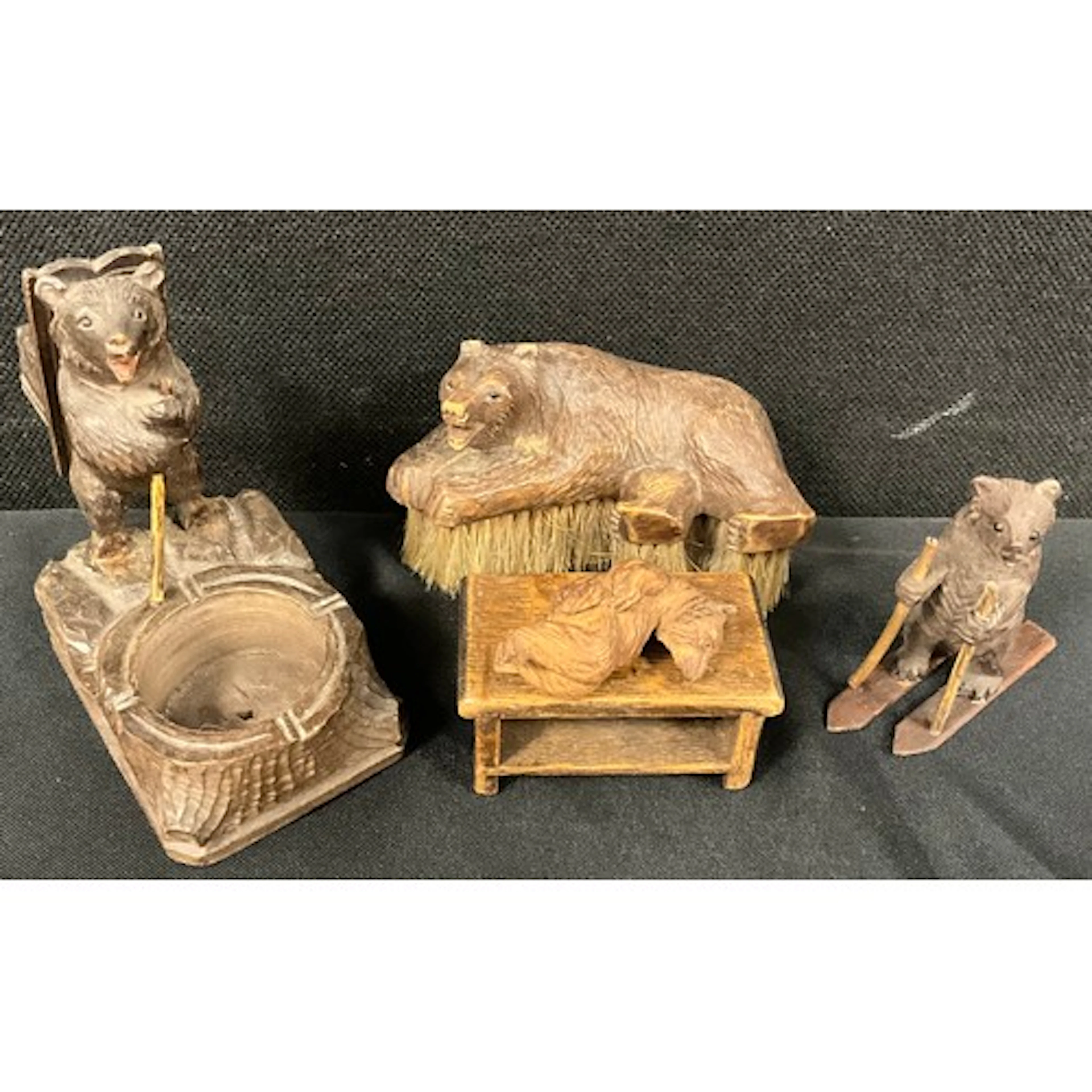 A carved black forest bear inkwell or desk tidy, with circul...