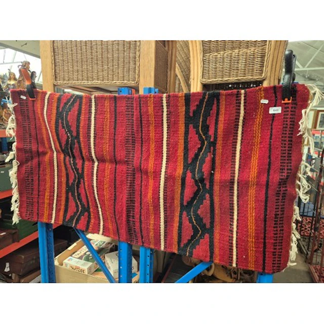A red ground kilim rug.