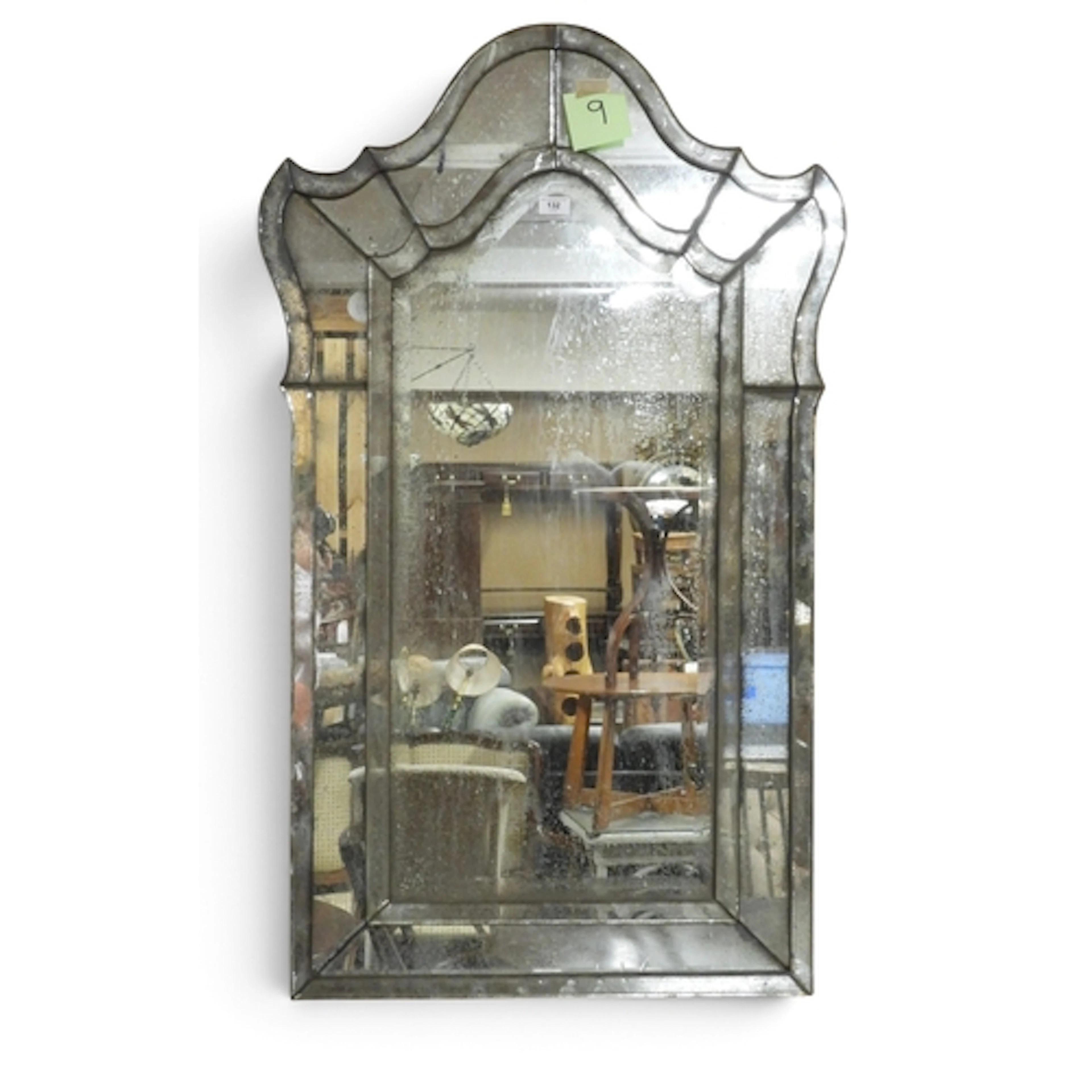A 20th century Venetian style wall mirror with shaped mirror...