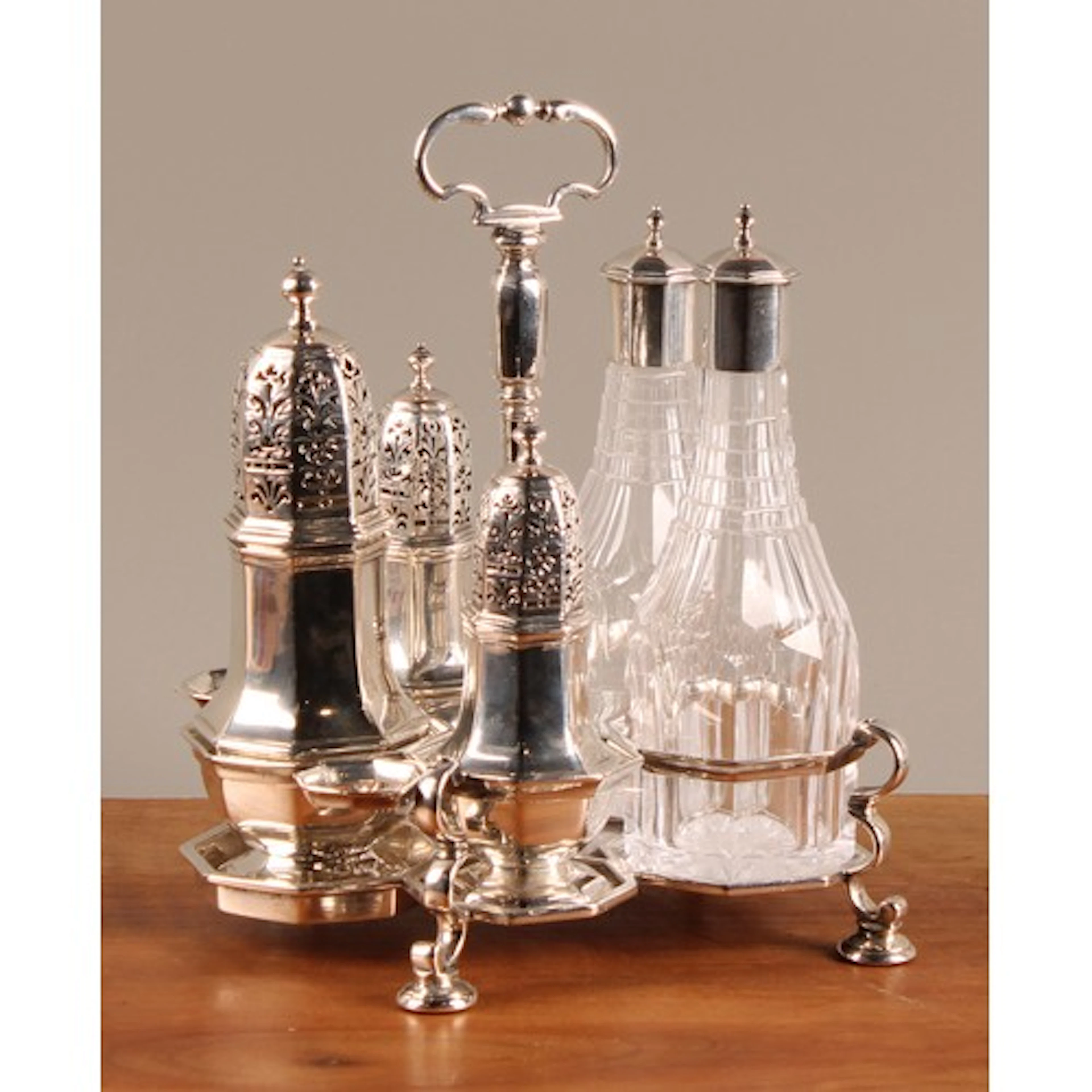 A George I silver Warwick cruet, comprising three octagonal ...