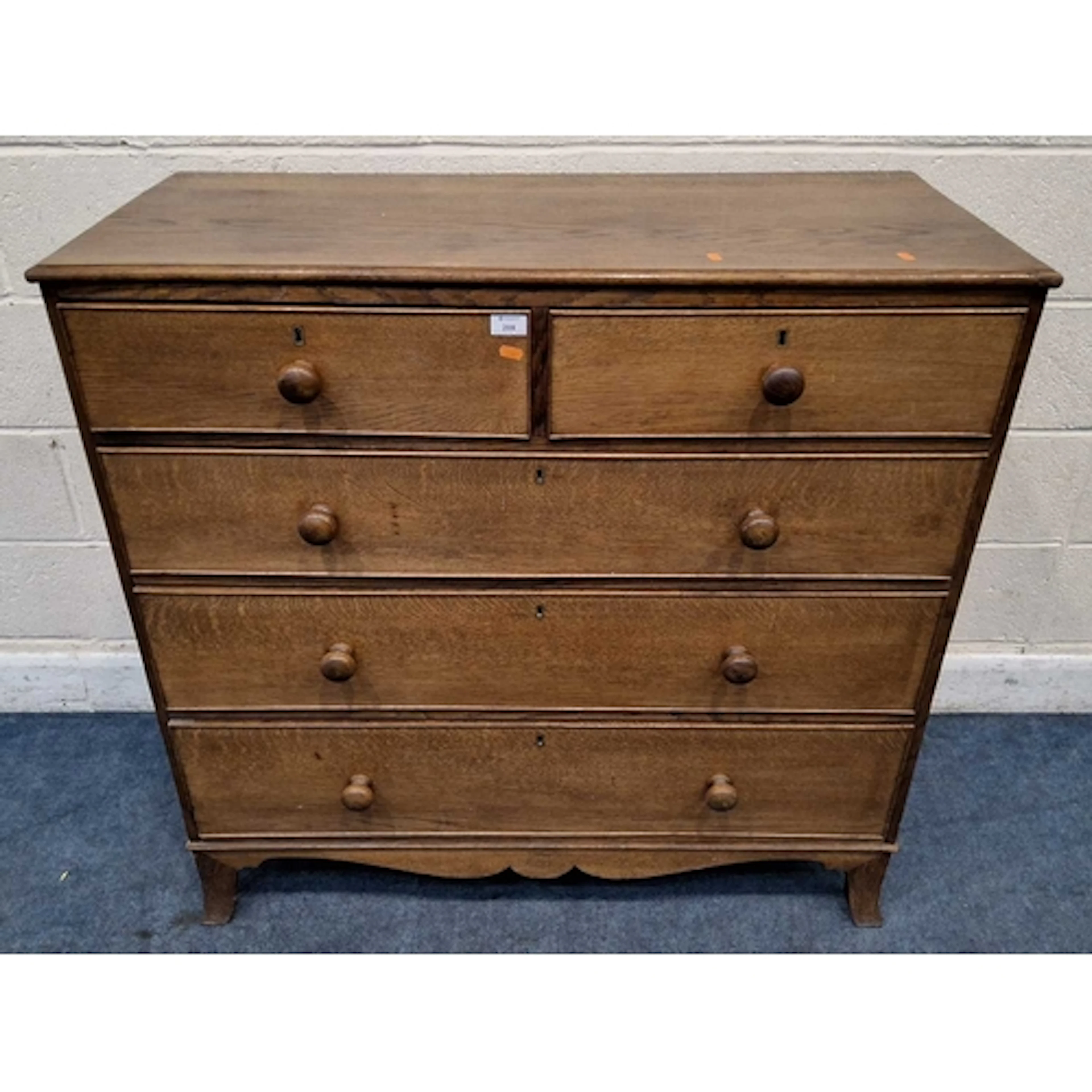 A LATE GEORGIAN OAK CHEST OF TWO SHORT OVER THREE LONG GRADU...