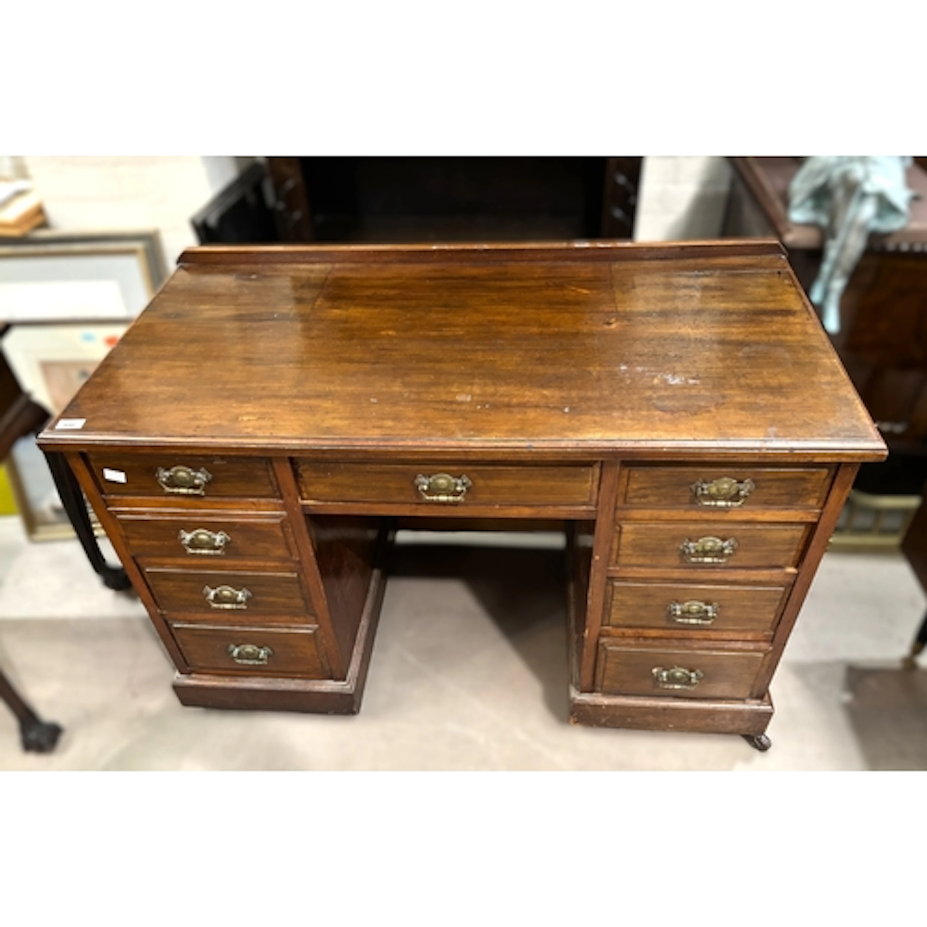 A late 19th/early 20th century mahogany desk with 9 drawers.