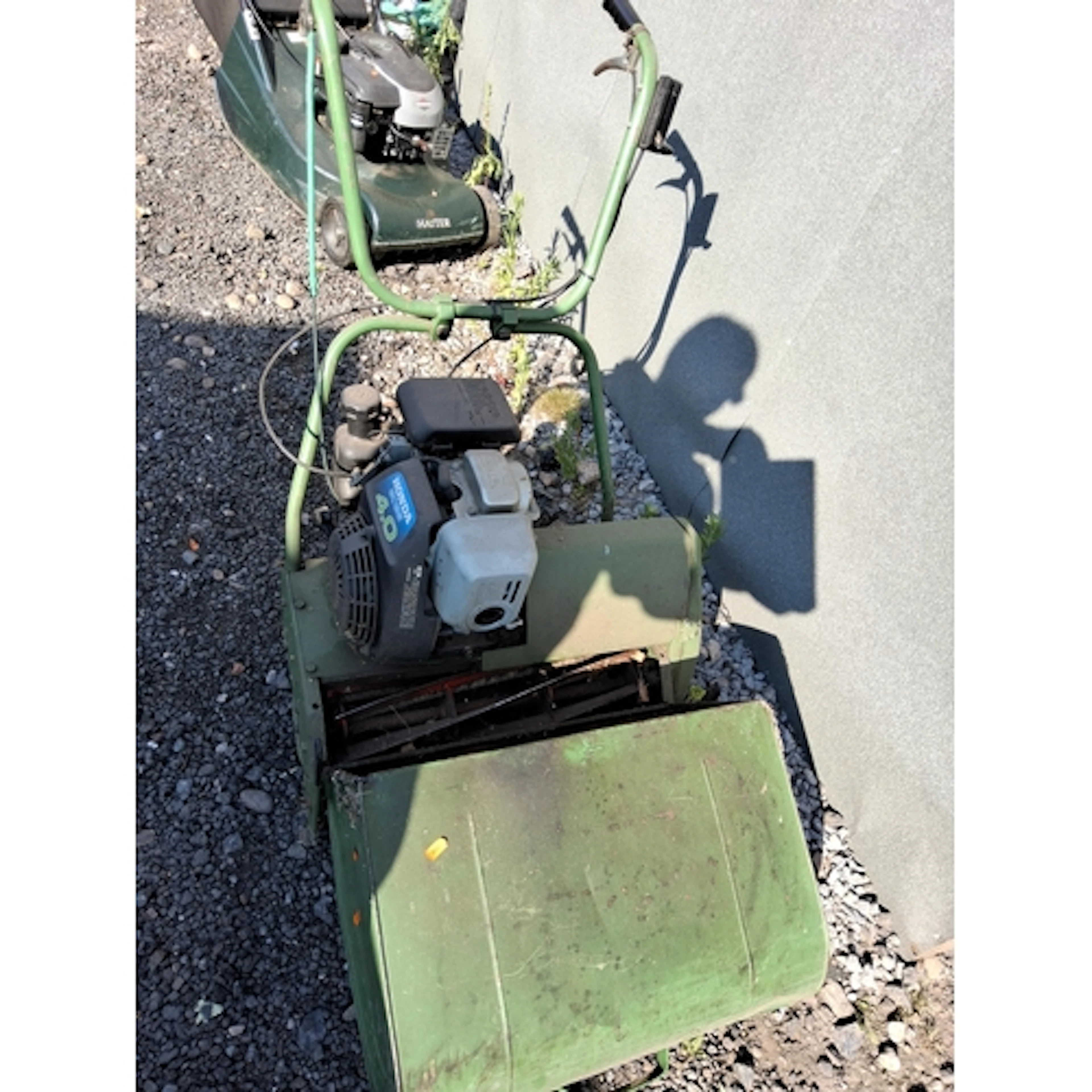 A HONDA POWERED PETROL CYLINDER MOWER with grassbox (engine ...
