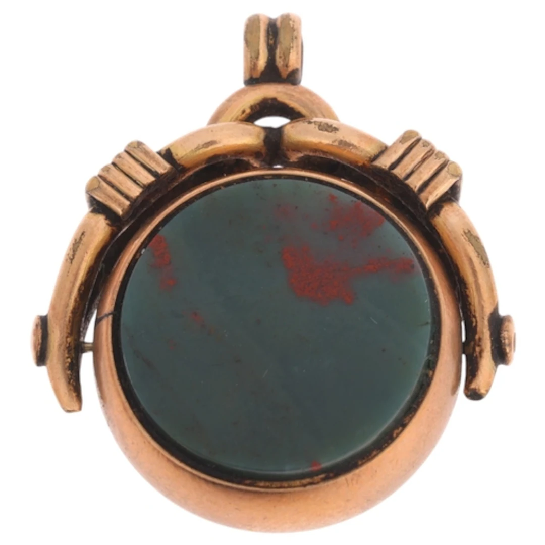 An Antique 9ct gold hardstone swivel fob, set to either side...