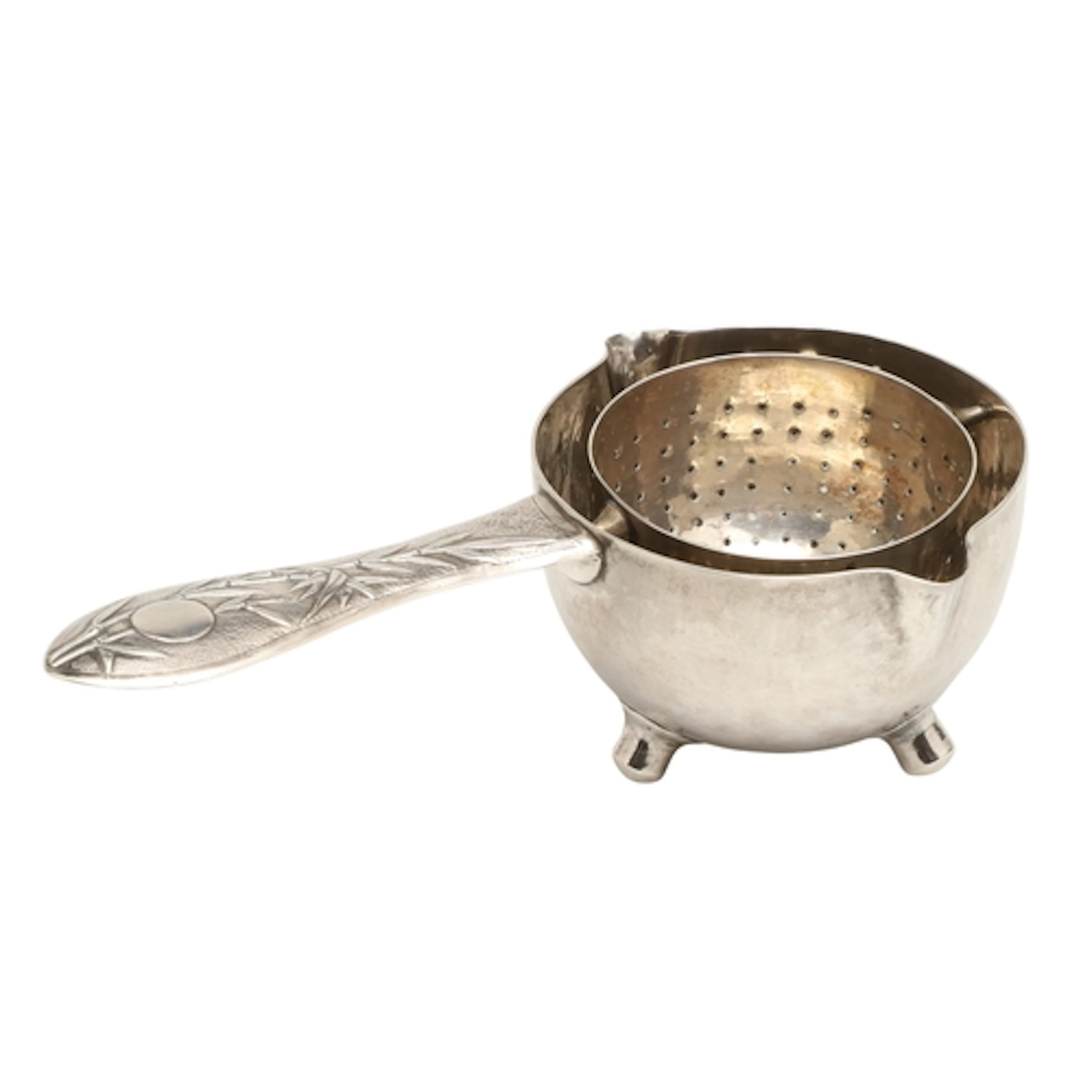 AN EARLY 20TH CENTURY CHINESE SILVER TEA STRAINER. Silver, e...