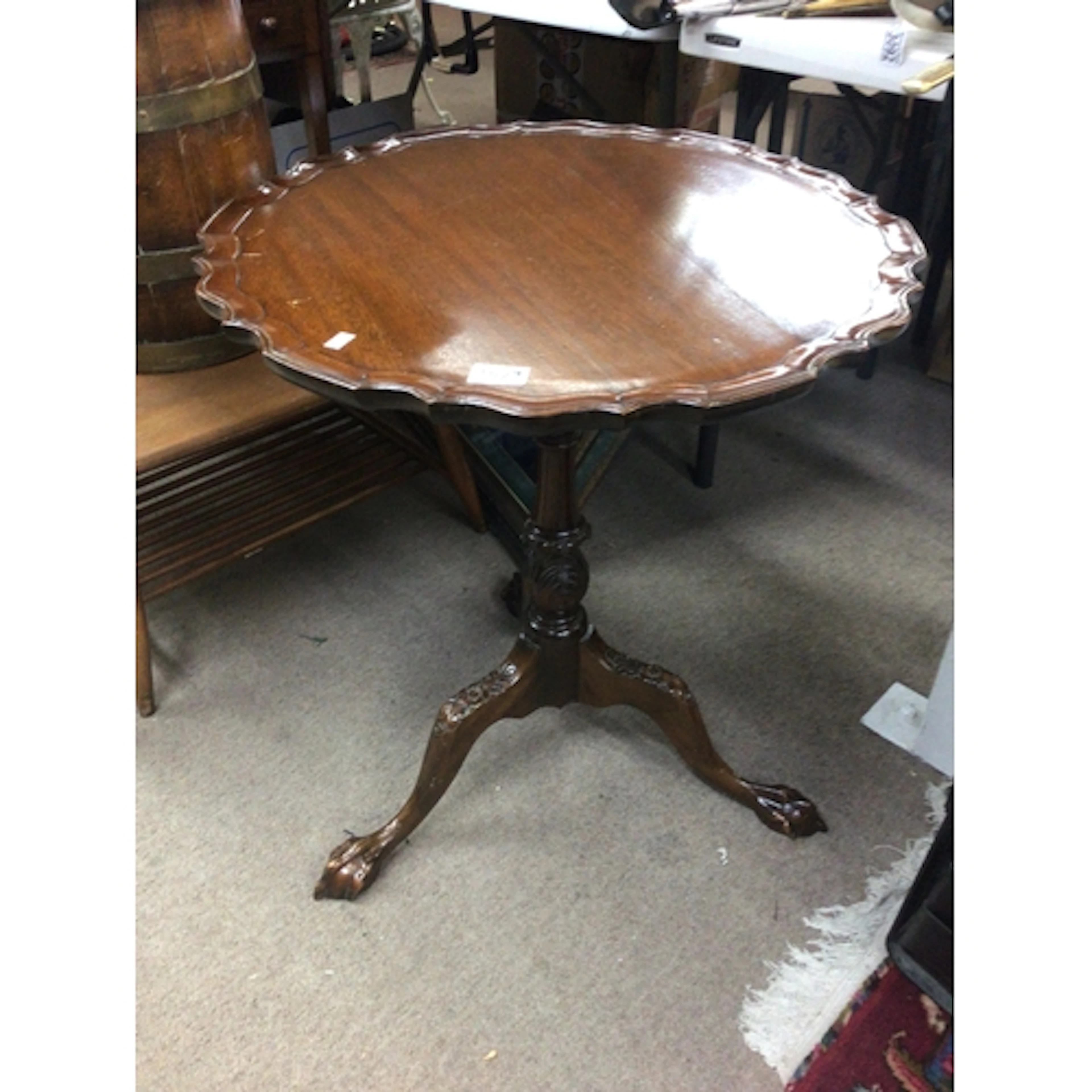 A late George III style tip action wine table with four pill...
