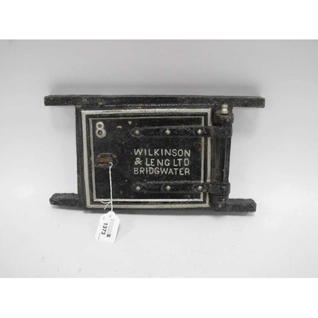 An Antique Cast-Iron Furnace Door Frame Manufactured by Wilk...