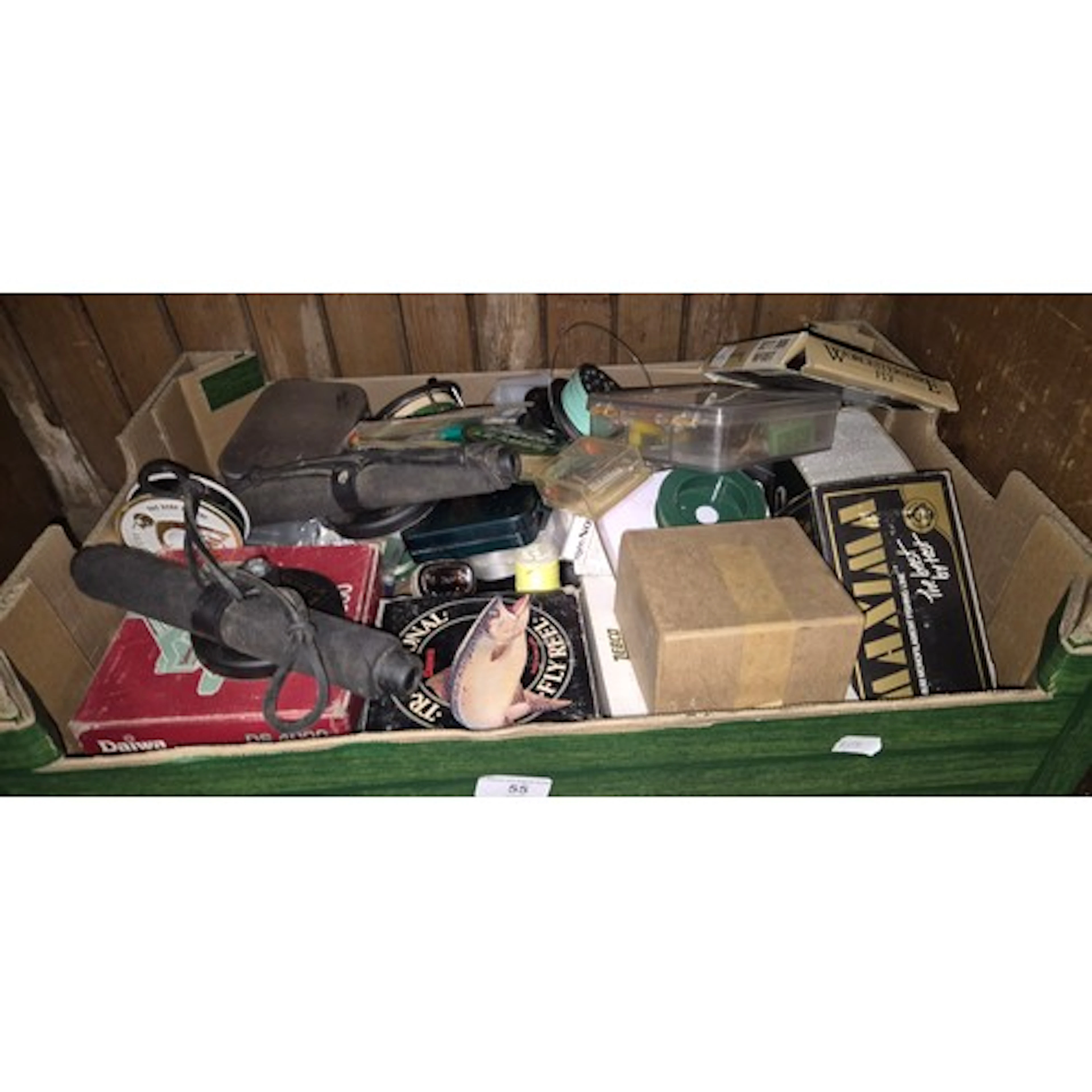 A box of fishing accessories including reels, floats, flies,...
