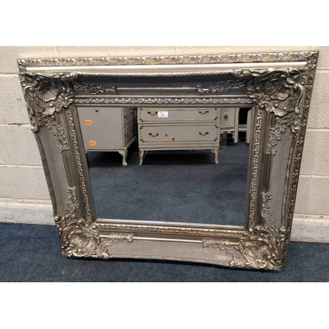 A RECTANGULAR DEEP FRAME SILVERED MIRROR, with shell, scroll...