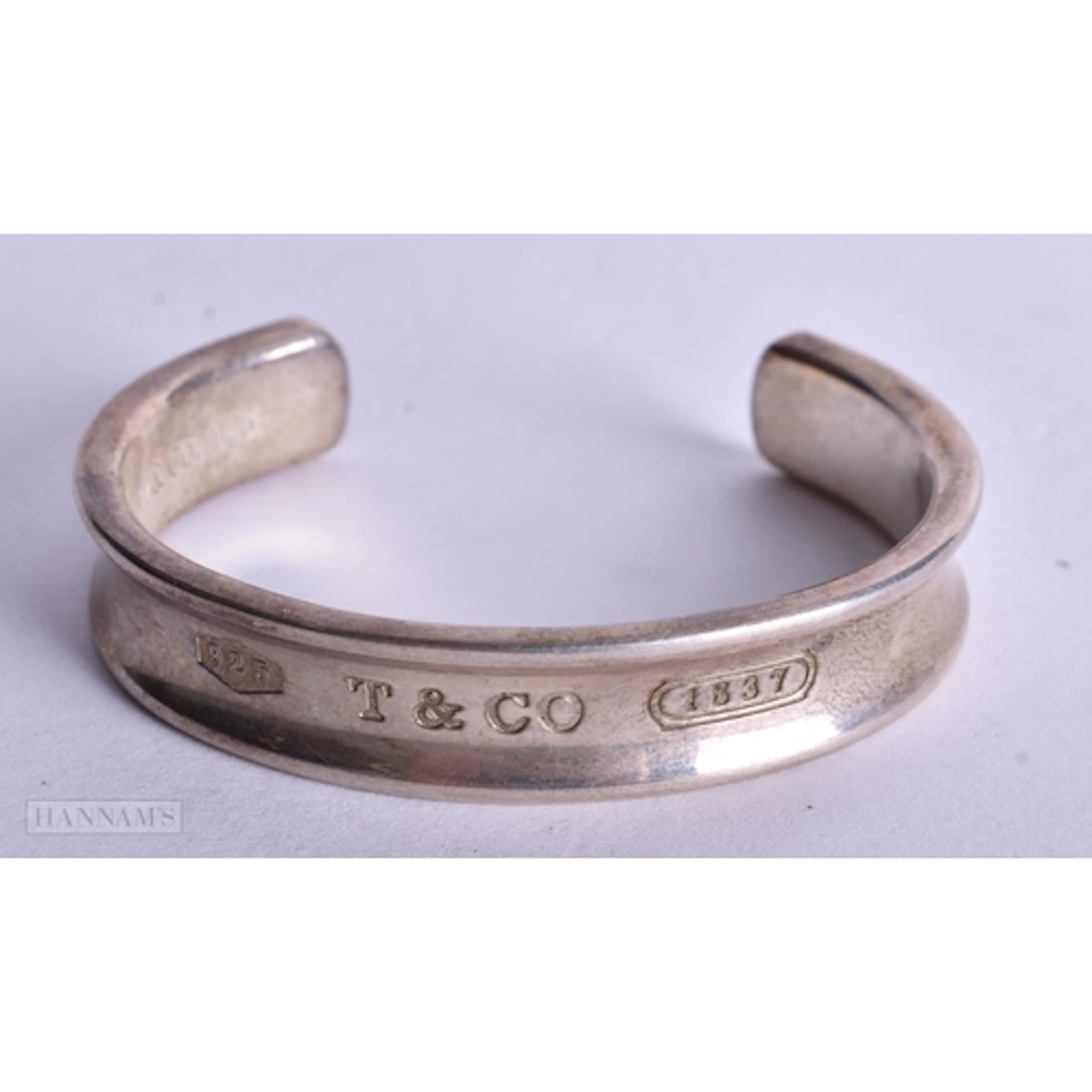 Sterling Silver Tiffany & Co Bangle (43g). 6.75 cm wide.