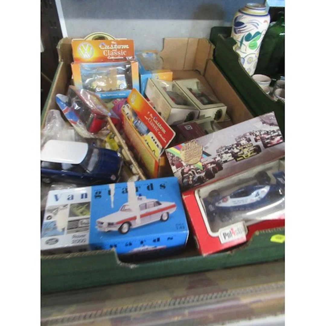 A box of model cars to include Vanguard examples