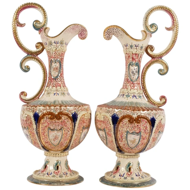 A pair of Antique Hungarian Fischer reticulated ewers, with ...