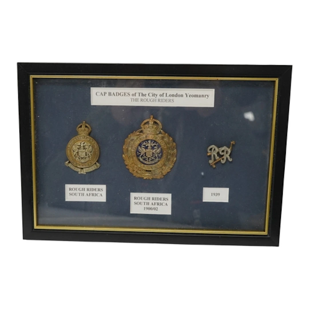 A framed display of three City of London Yeomanry badges, in...