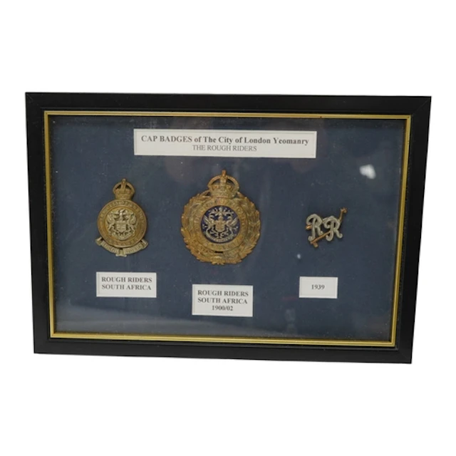 A framed display of three City of London Yeomanry badges, in...