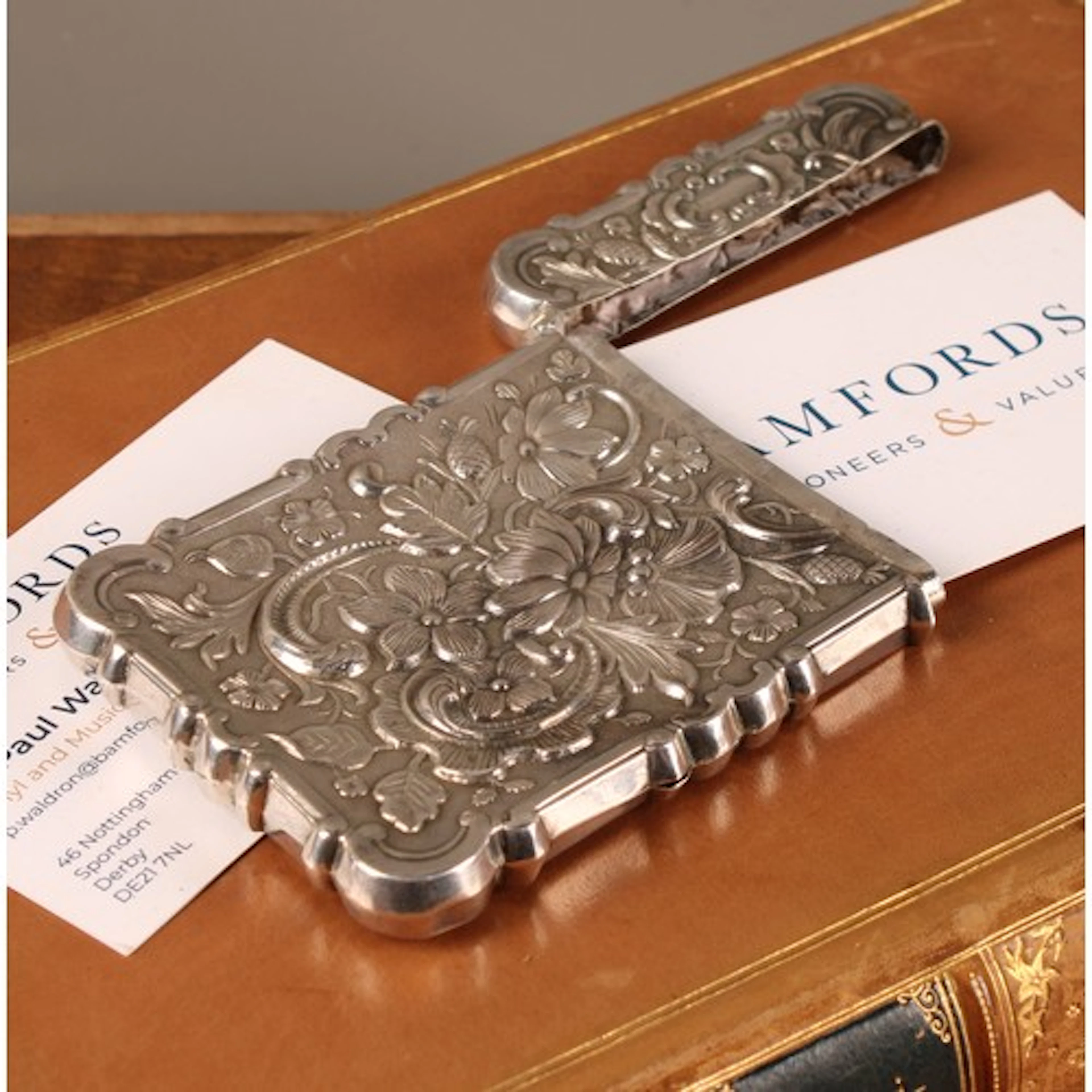 A 19th century silver coloured metal shaped rectangular cast...