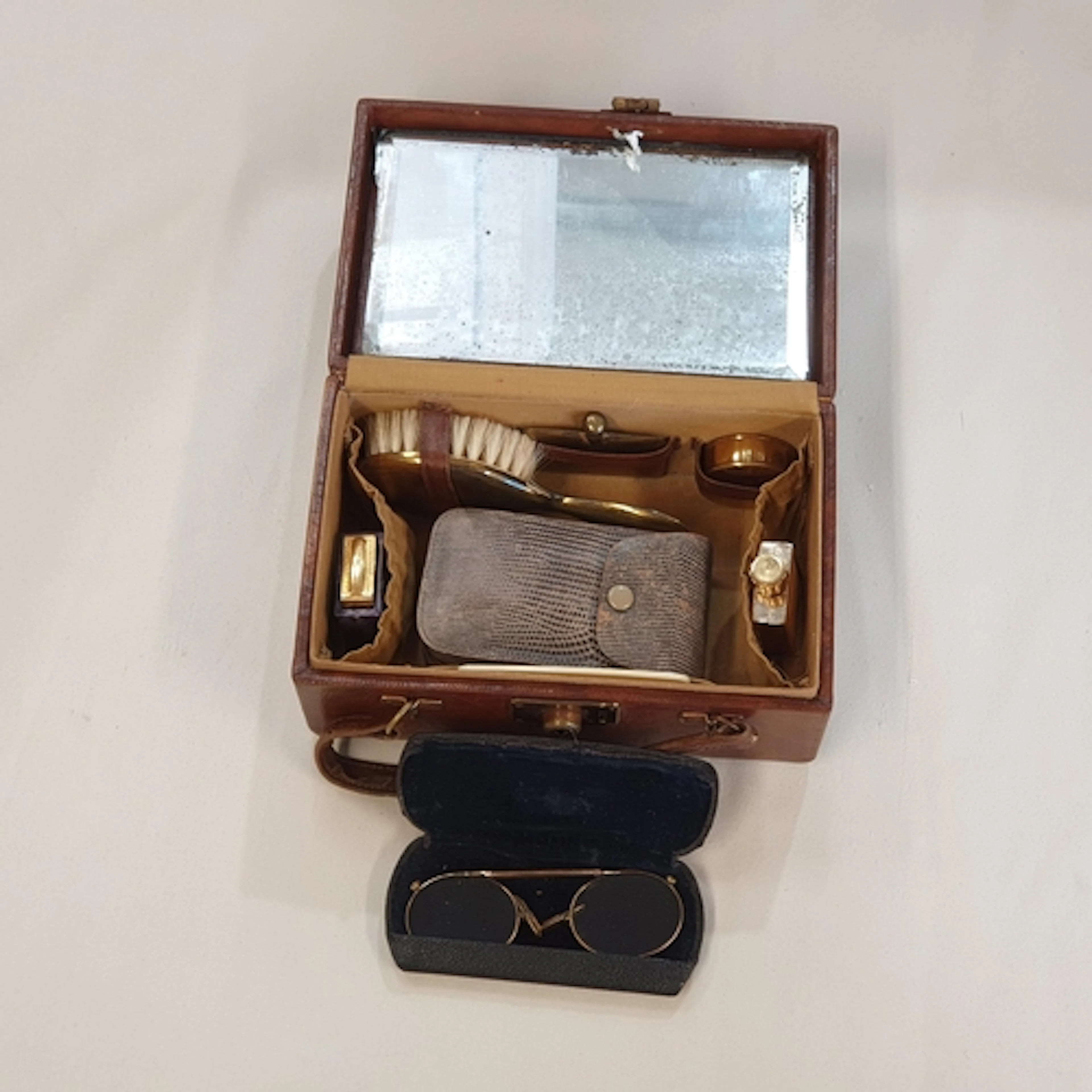 A vintage leather Travel Vanity Case with accessories, also ...
