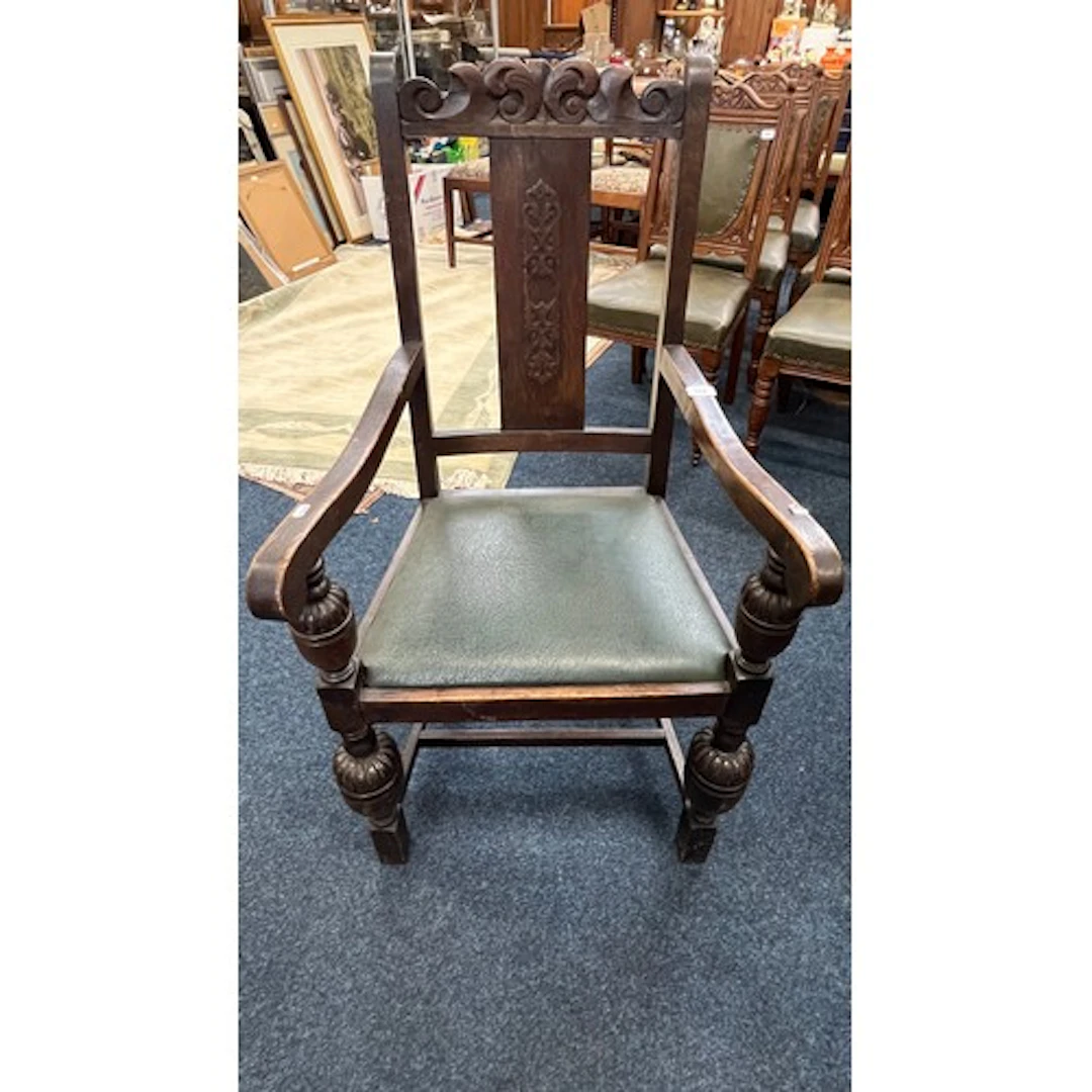 Antique carved oak armchair.