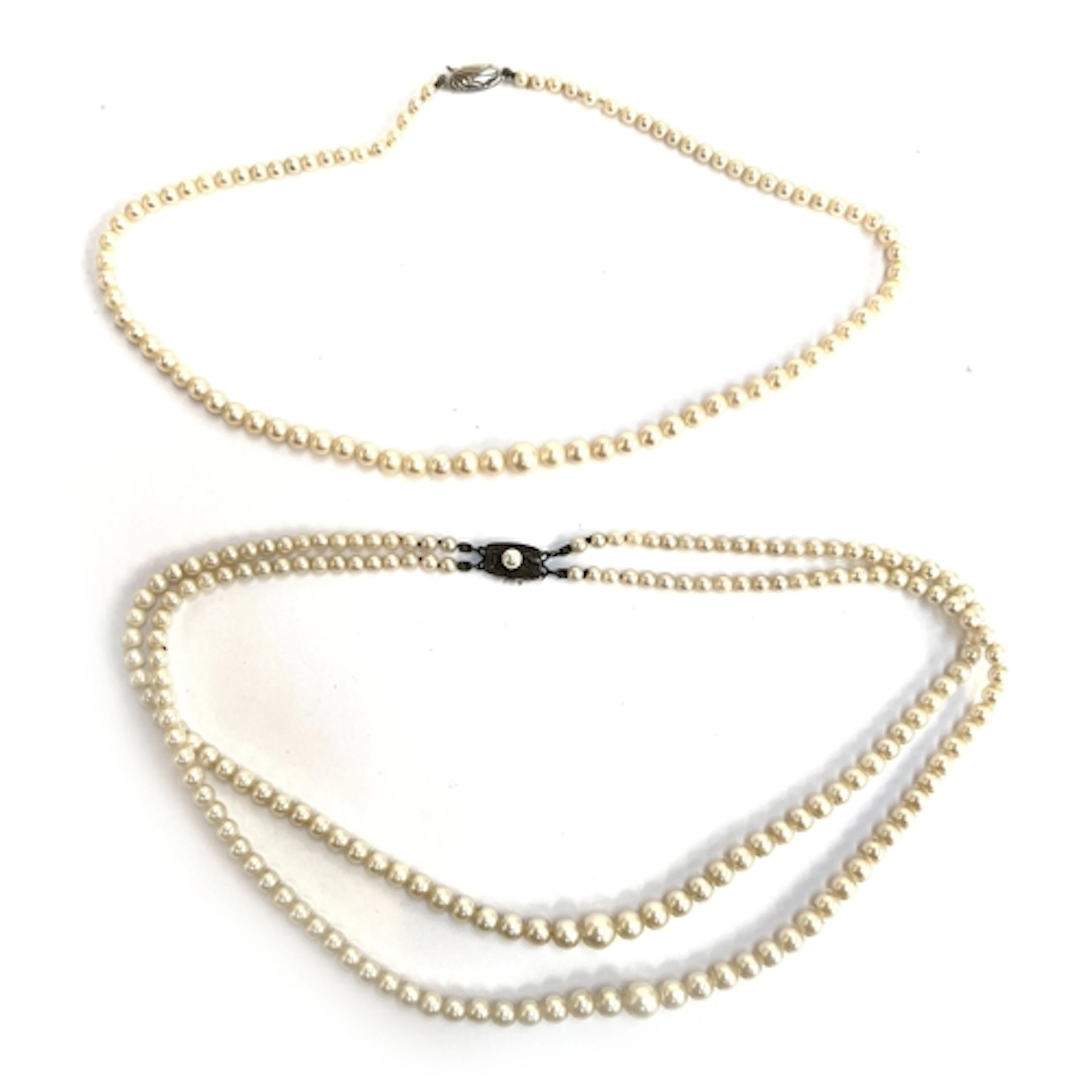 A vintage Mikimoto double strand pearl necklace, fastening w...