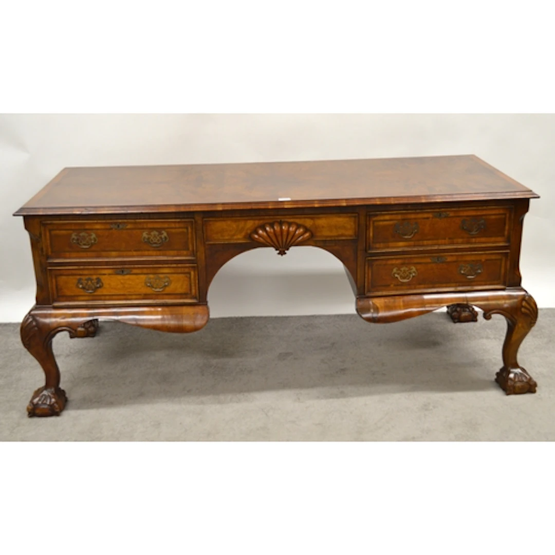 Continental walnut kneehole partner's desk, the moulded top ...