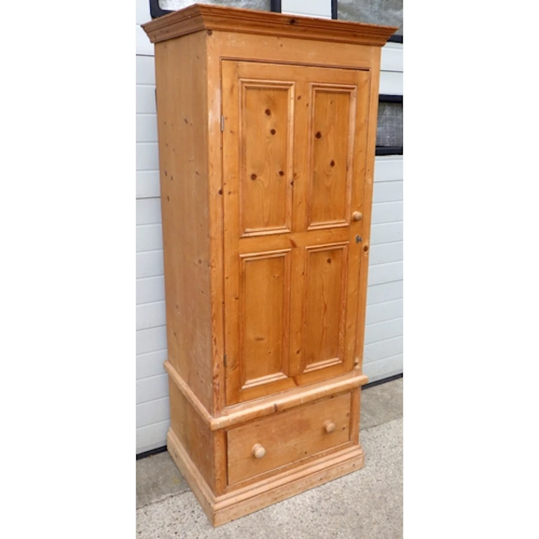 A narrow modern pine wardrobe with lower drawer, marks, 80cm...