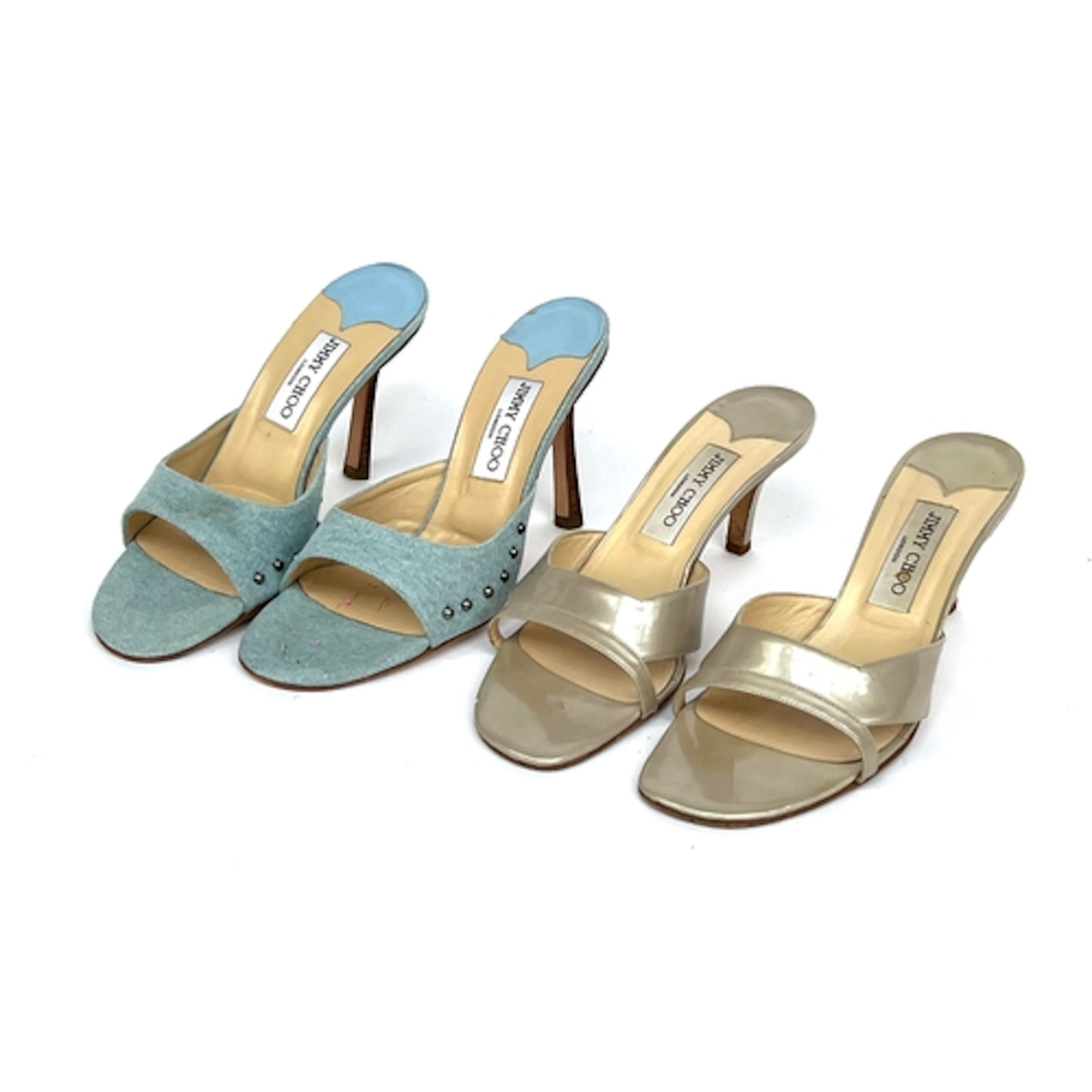 Two pairs of Jimmy Choo heels, one in blue denim with stud d...