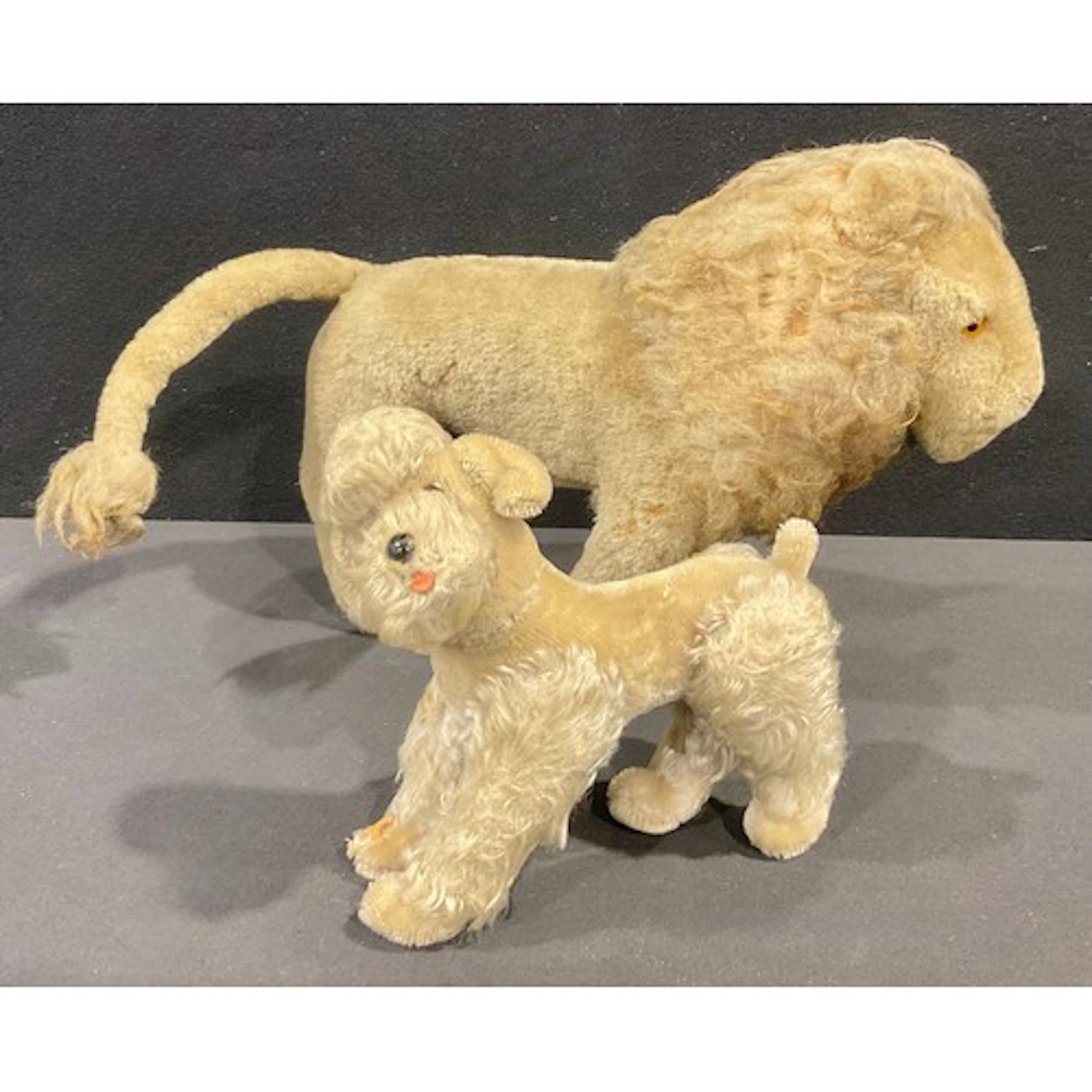 A mid-century Steiff mohair poodle, articulated legs, 23cm h...
