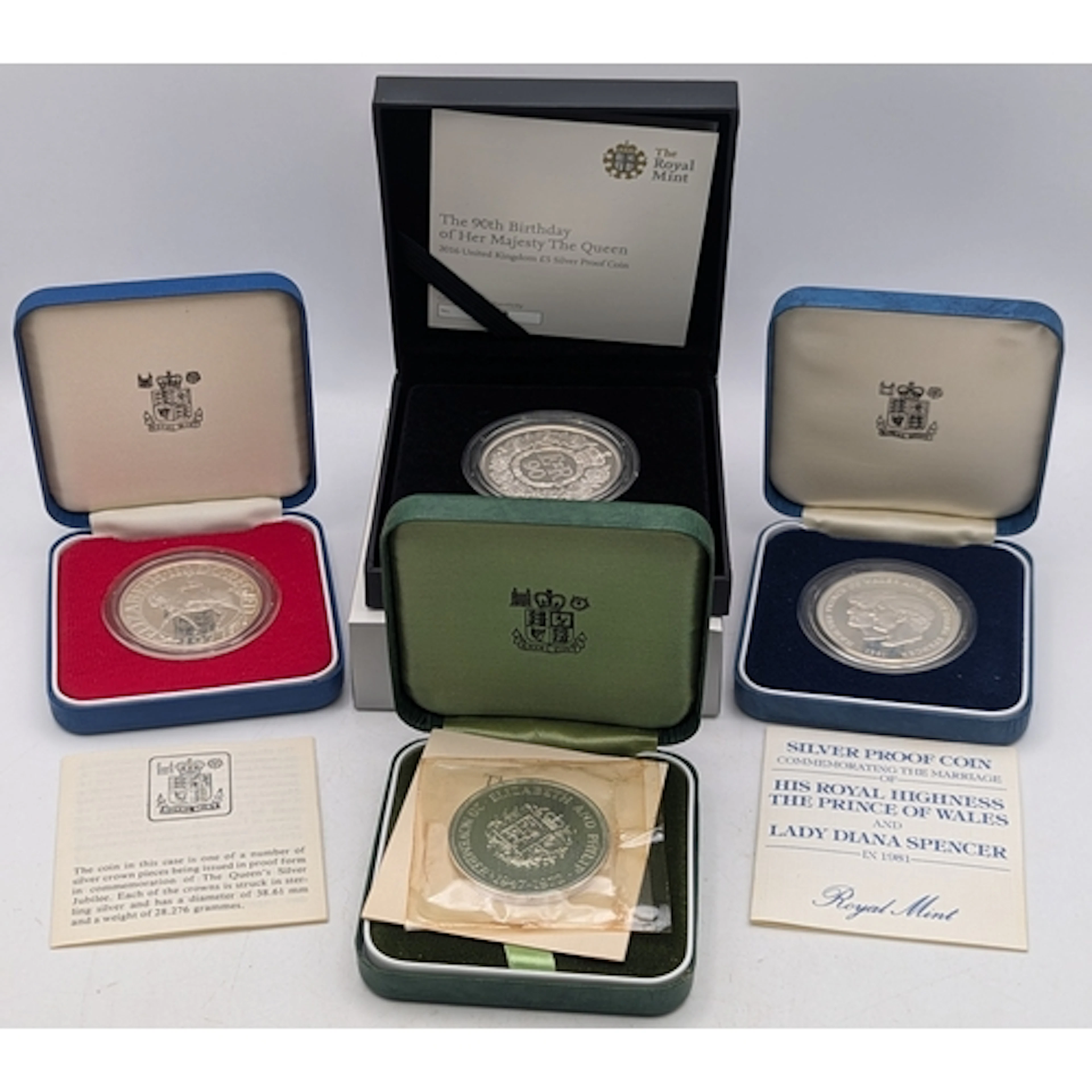 Three silver proof British commemorative coins to include a ...