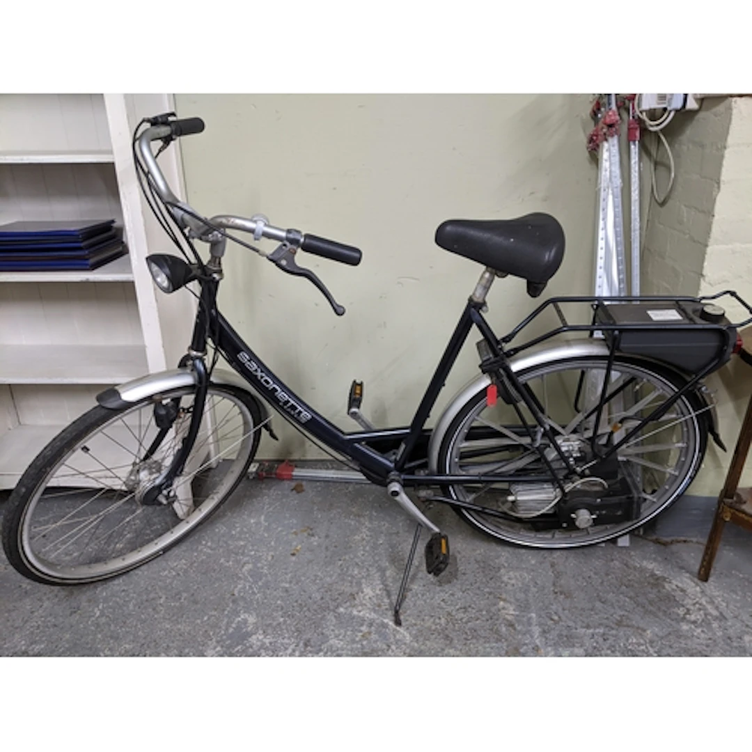 A Saxanette Luxus petrol bike in a black and silver coloured...