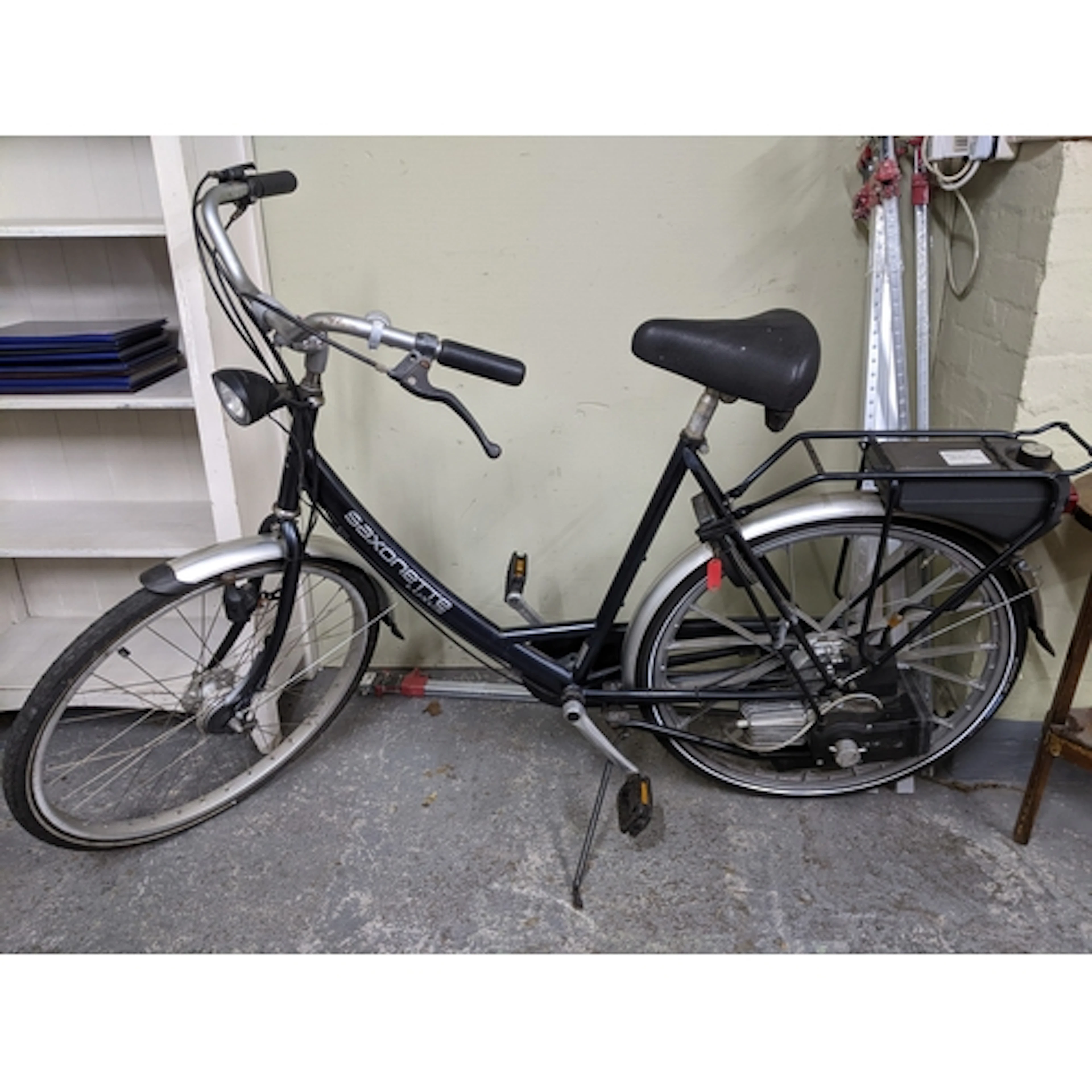 A Saxanette Luxus petrol bike in a black and silver coloured...