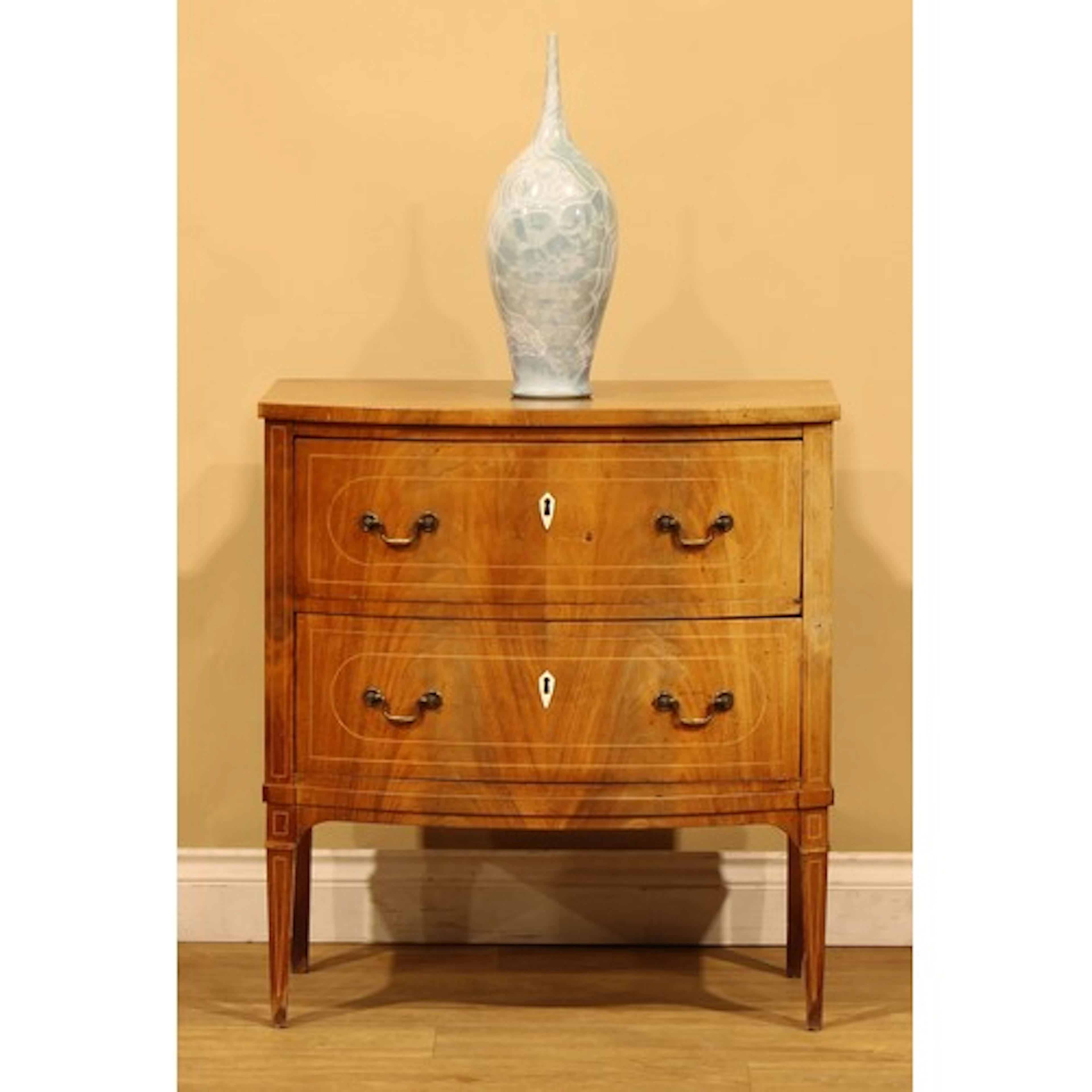 A Sheraton Revival mahogany and marquetry bowfront bedroom c...