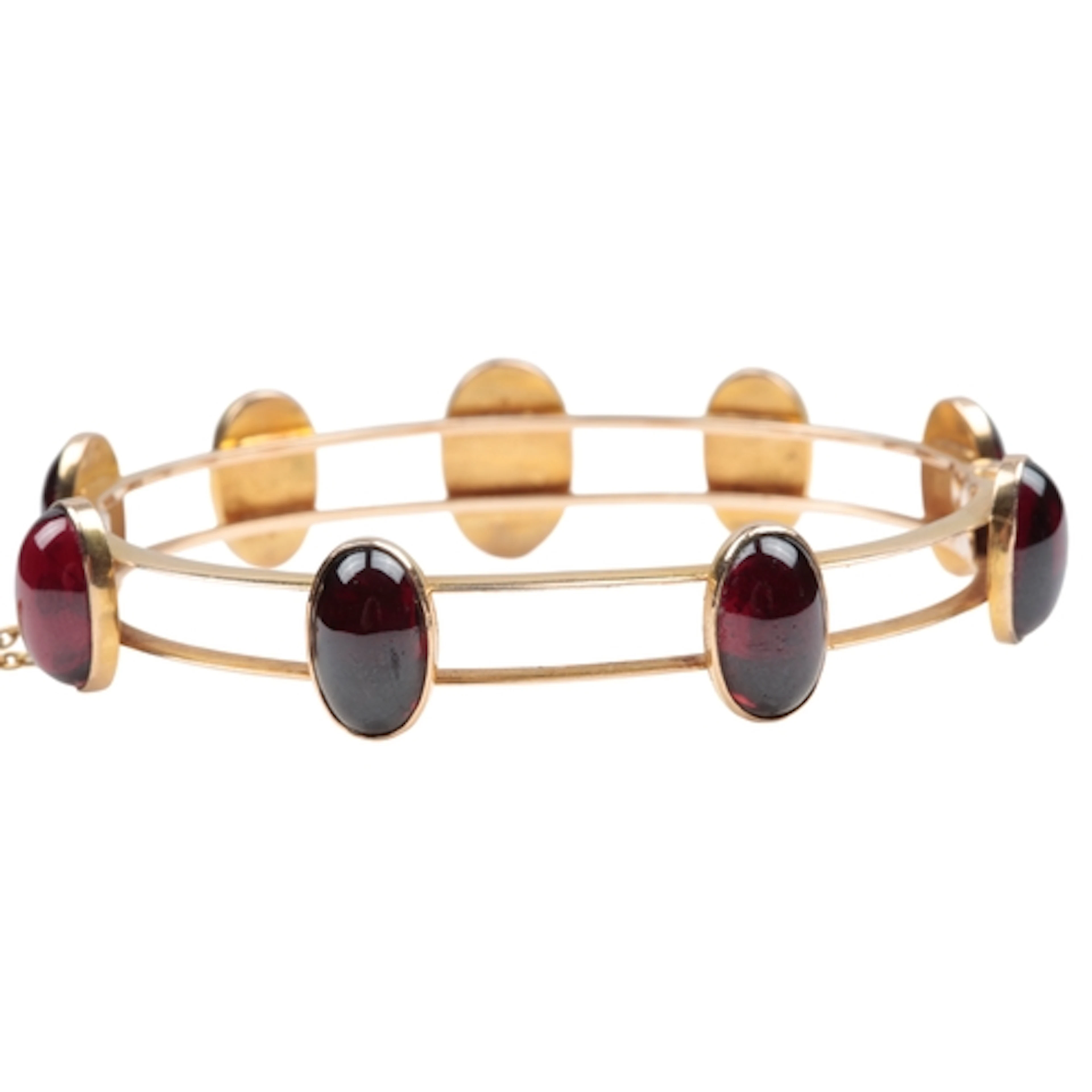An attractive Victorian gold and garnet bangle, late 19th ce...